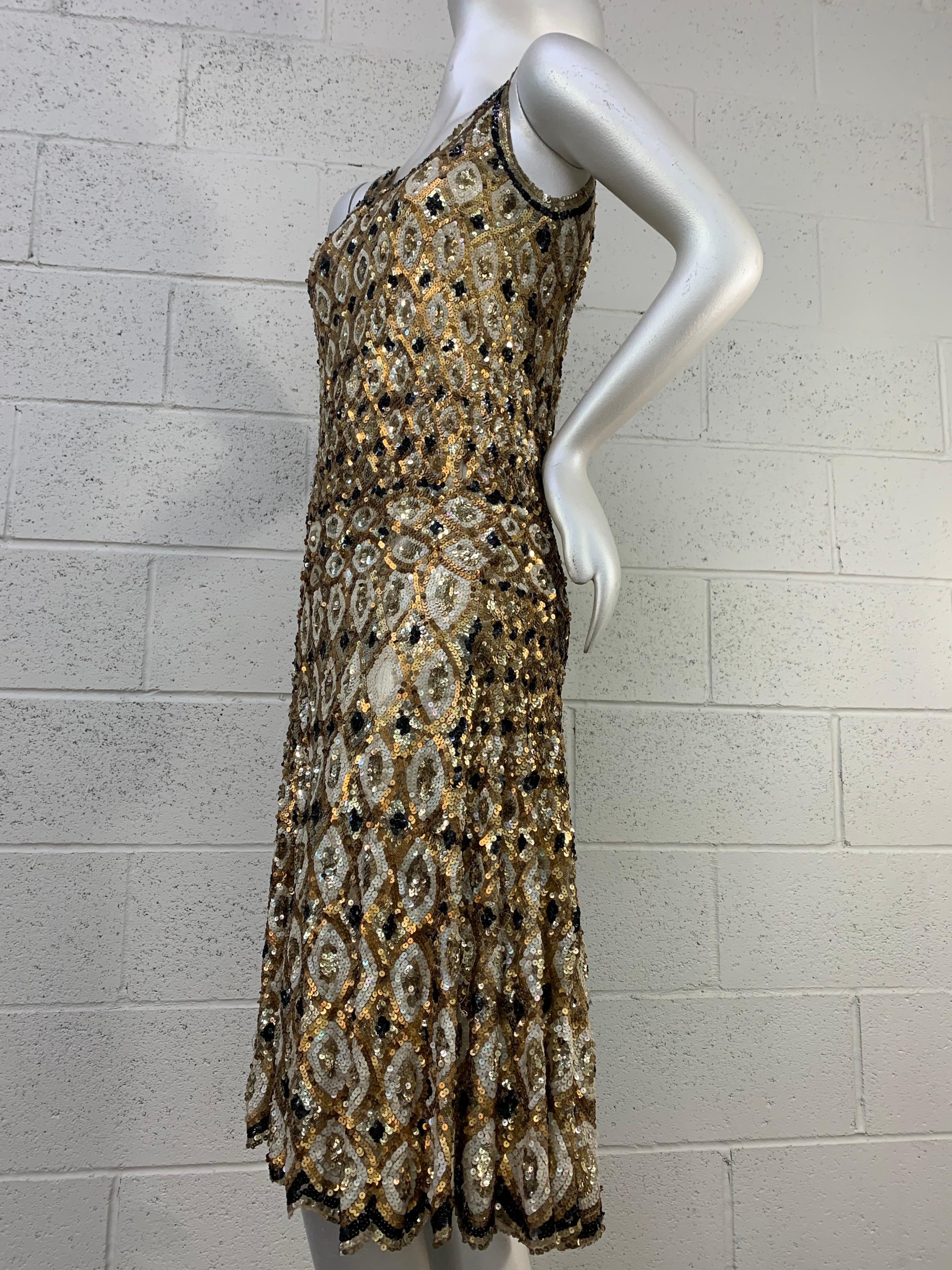 A truly spectacular 1920s French-made Art Deco styled harlequin patterned sequin dancing dress in gold and black. Very full skirt with dropped, banded waist for lots of movement. Diamond pattern on silk net is graduated from larger at bottom to