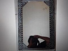1920's French Art Deco Highly Carved and Distressed Silvered Wood Wall Mirror