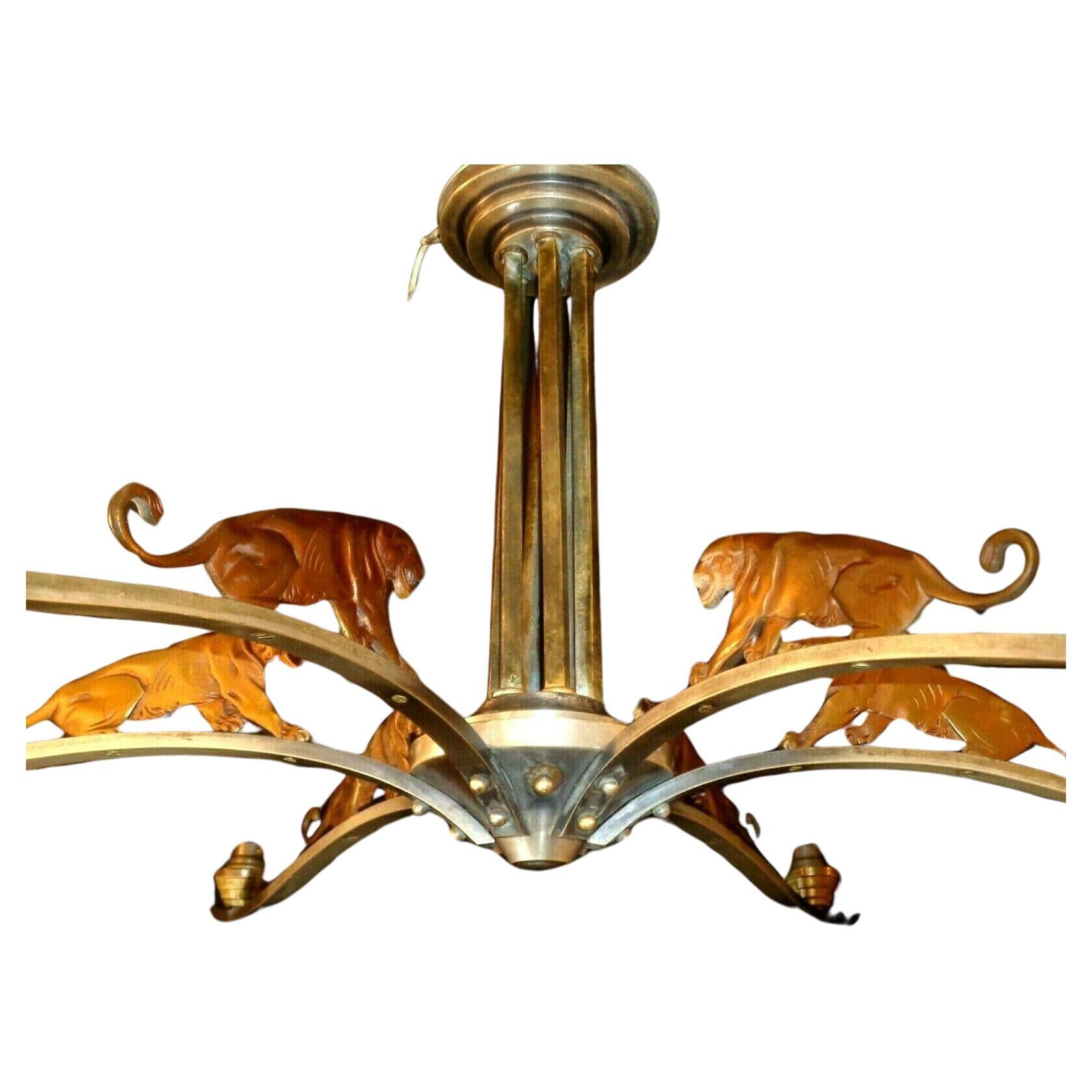 Absolutely stunning Bronze Roaring Tigers Prancing across a Nickel Framed Chandelier. Look at the detailed bronze panthers prowling.