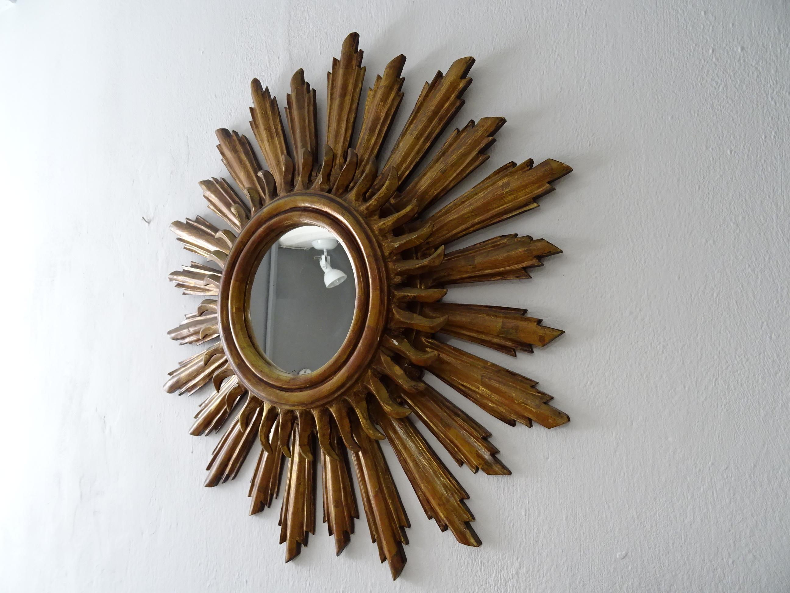Beautiful big French wood gold starburst. Amazing patina. Double wood with mirror in perfect shape. Mirror itself measures 7.5 inches round. Small chipping as shown.  Free priority UPS shipping from Italy, (approx.  days) no custom fees.