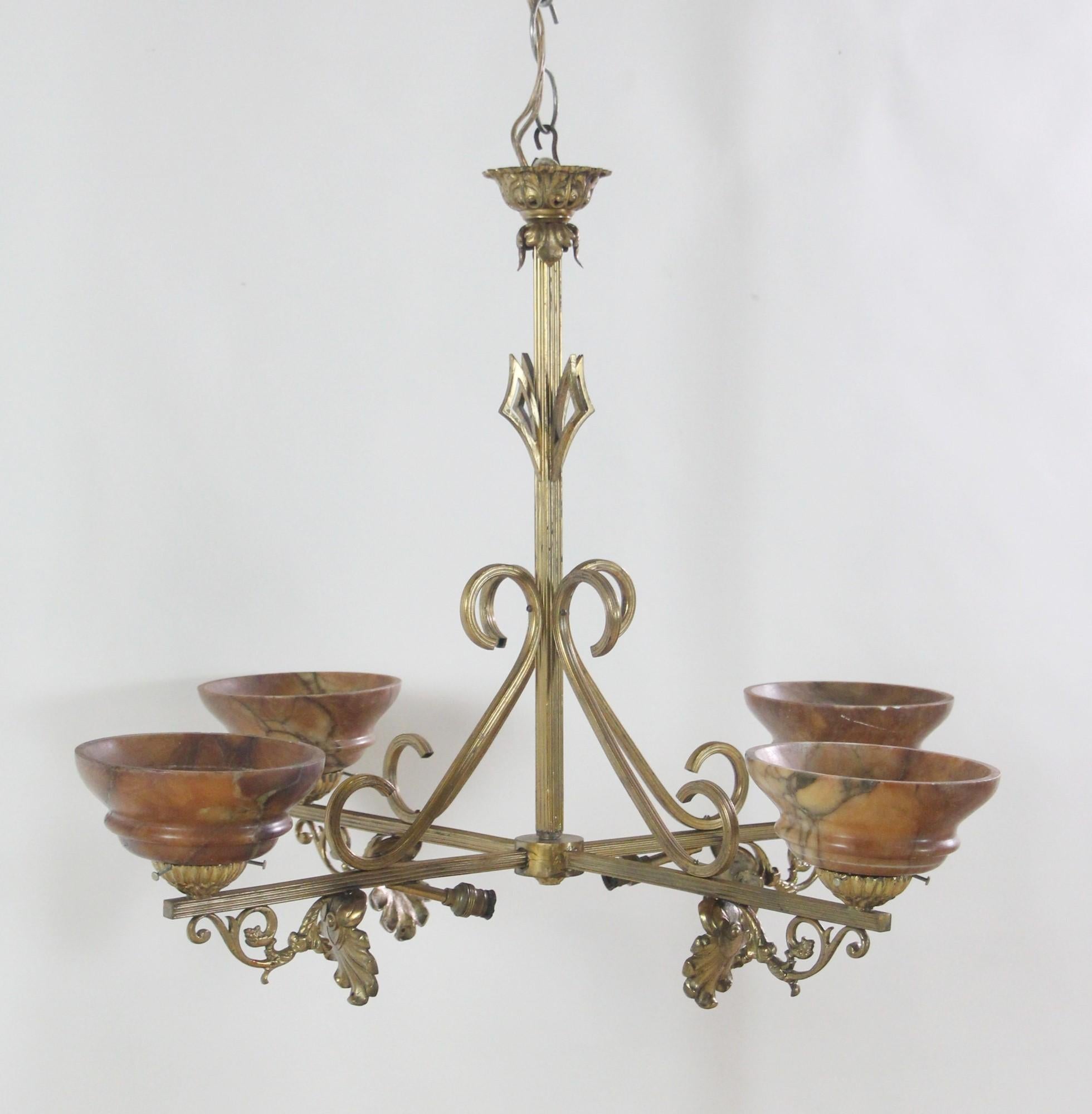 Antique brass chandelier with four arms featuring leaf design and burgundy alabaster shades. This French light is circa 1920s and has an elegant design. Price includes rewiring. This can be seen at our 400 Gilligan St location in Scranton, PA.

 
