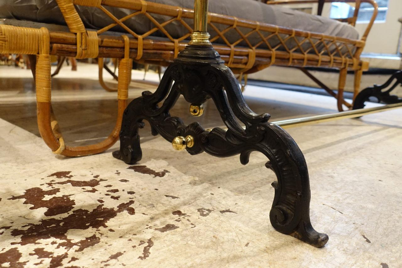 Gorgeous and seldom found vintage French clothes rack from, circa 1920s. Formed in brass in brass, with elegantly designed cast iron feet. The centre rod is adjustable.
