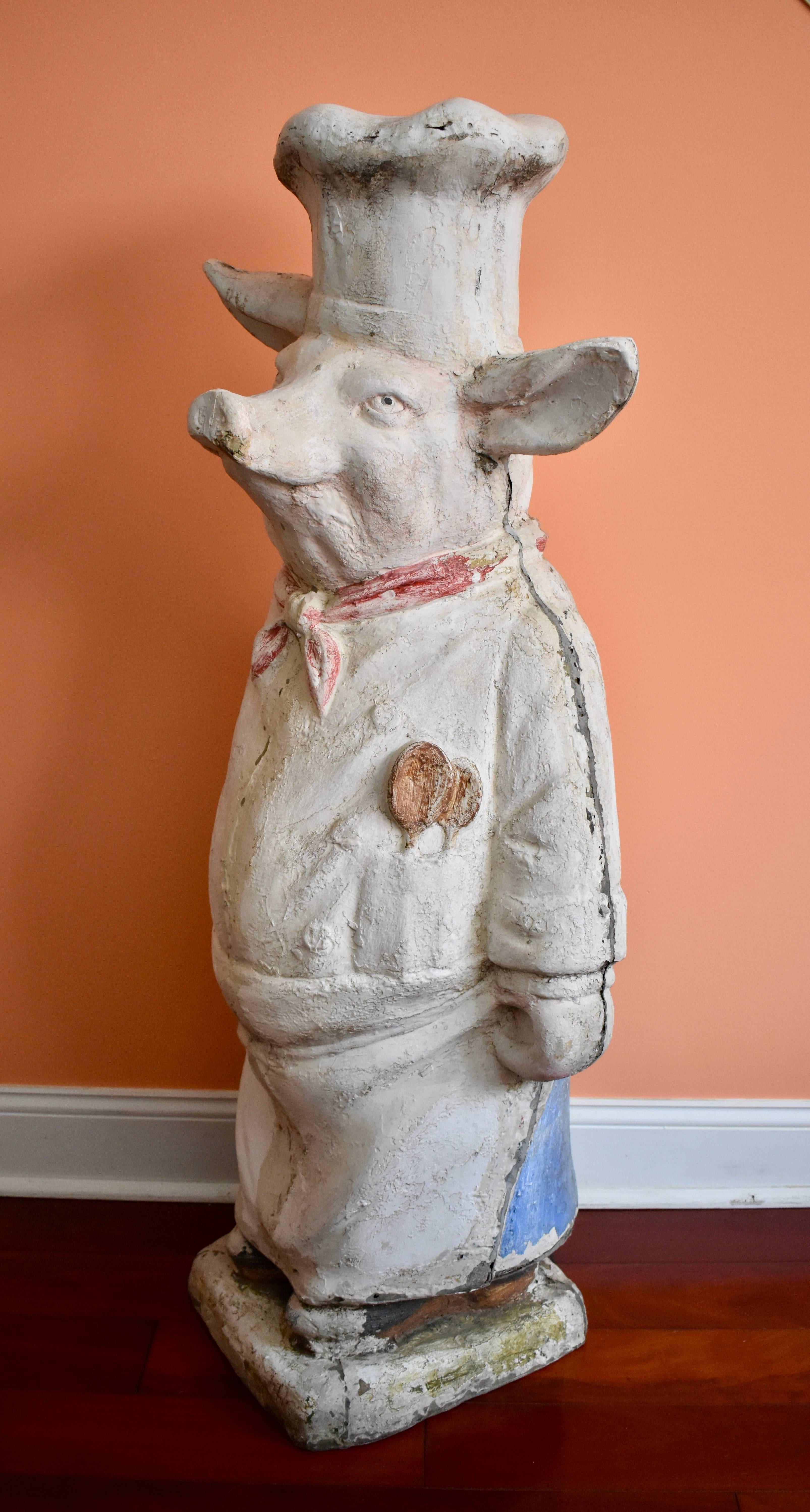 Fabulous for a charcuterie, restaurant, bar, gourmet food shop, or a home kitchen, an authentic French butcher shop pig, circa 1920s, made of plaster covered composite. Standing over four feet high and displaying a marvelous personality, he would