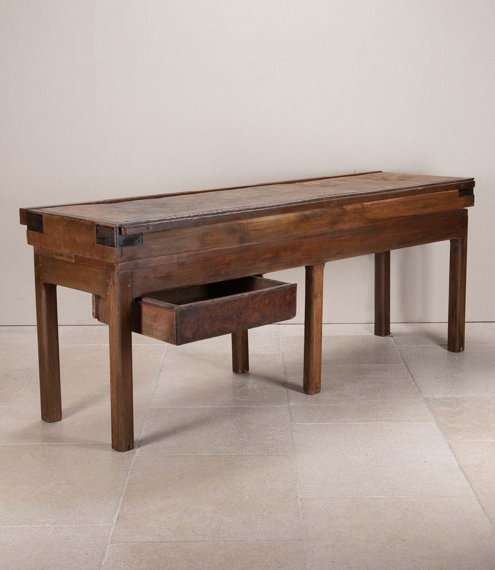 A simple yet handsome 1920s French butchers chopping block in beech and chestnut. The block is well worn and has a knife rack to the rear and a single drawer beneath.
