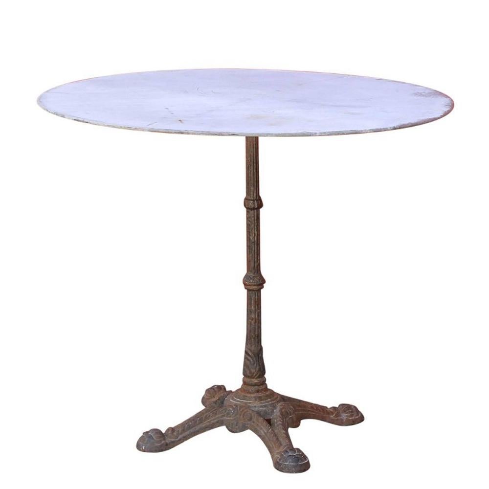This bistro table came to us by way of France and dates to the 1920s. The base is cast iron and the top is galvanized zinc, making this piece perfect for the garden, patio, or deck. It also works wonderfully indoors, in a breakfast nook or as a