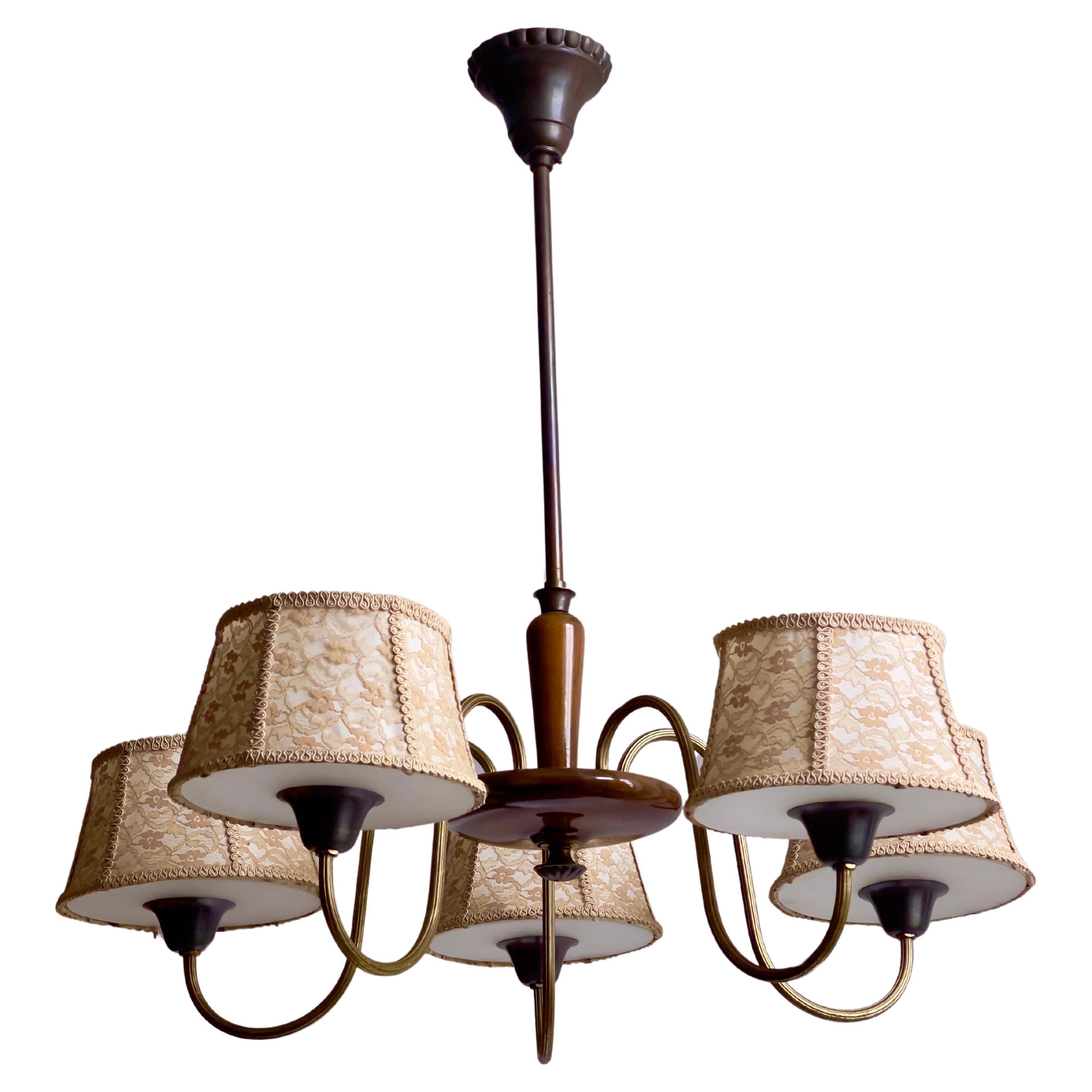 1920s French Chandelier in lacquered wood, bronze, brass and frosted glass. For Sale