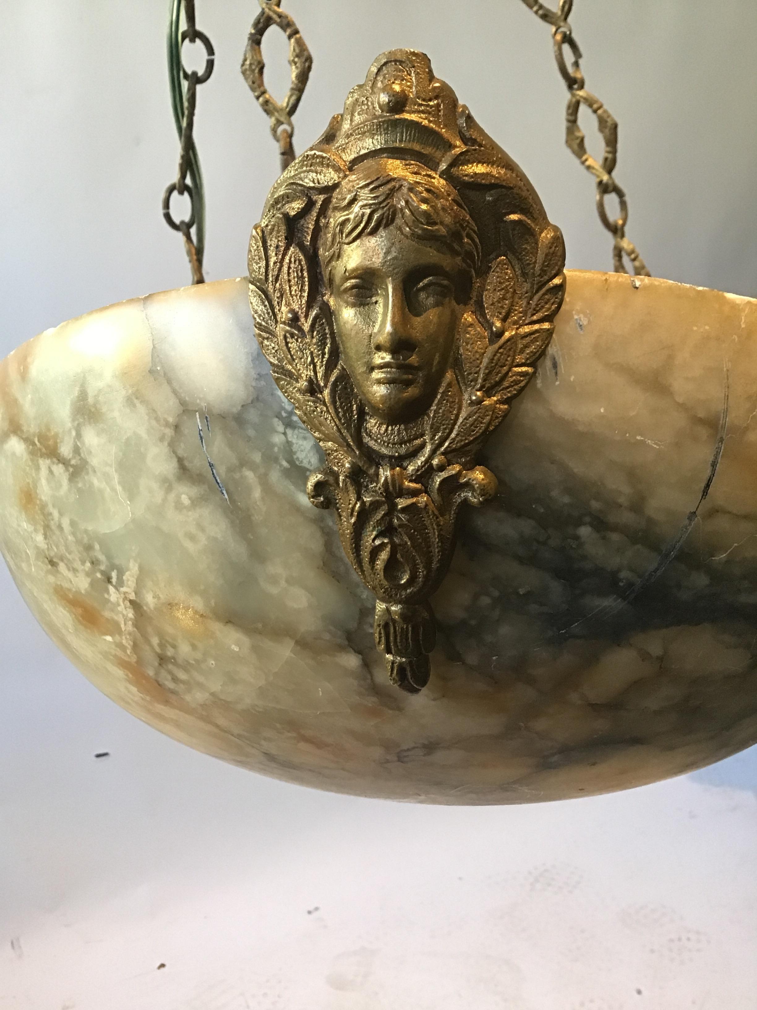 1920s French classical alabaster fixture with brass ornaments.
This item can easily be shipped via UPS.