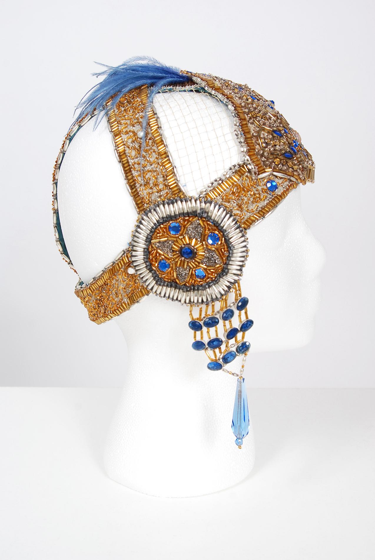 Breathtaking 1920's French metallic gold beaded and sapphire-blue jeweled flapper headdress. This is, without a doubt, one of the most extraordinary antique flapper period pieces I have ever laid eyes on. Large scale jewels, gold sequins and