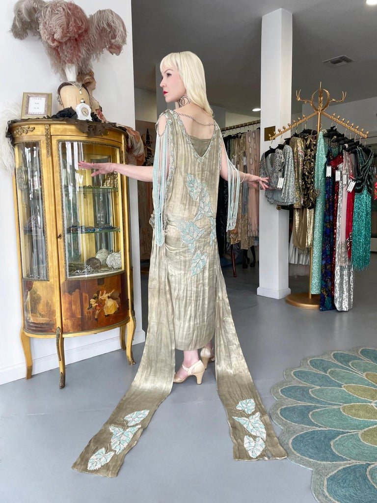 1920's French Couture Metallic Gold Lam Beaded Leaf-Motif Trained Flapper Dress For Sale at 1stDibs | gabesy hip seat carrier, 1927 clothing, gold lame dress 1920's French Couture Metallic Gold Lam Beaded Leaf-Motif Trained Flapper Dress For Sale at 1stDibs | gabesy hip seat carrier, 1927 clothing, gold lame dress
