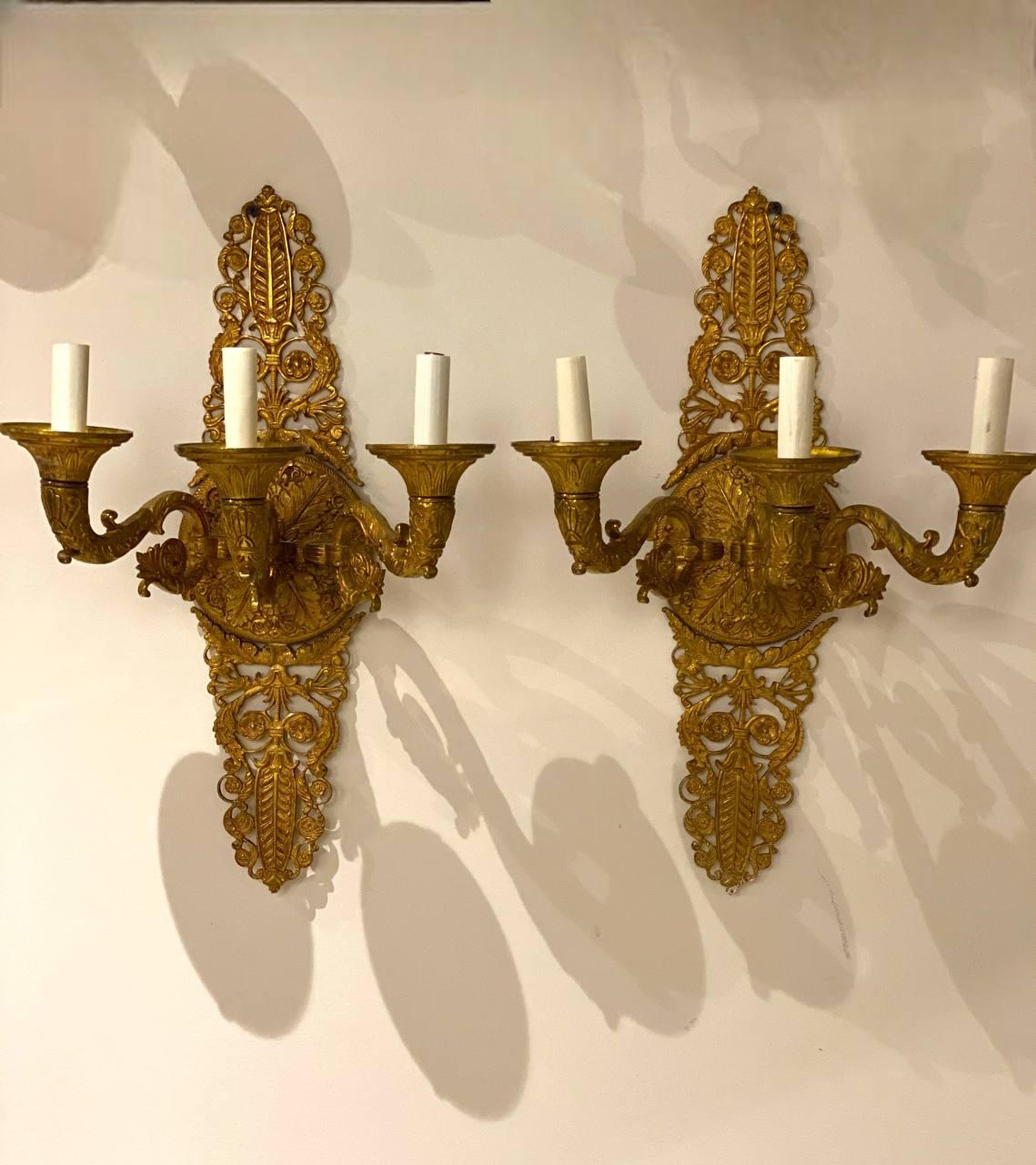 A pair of large French empire style sconces with 3 lights 
