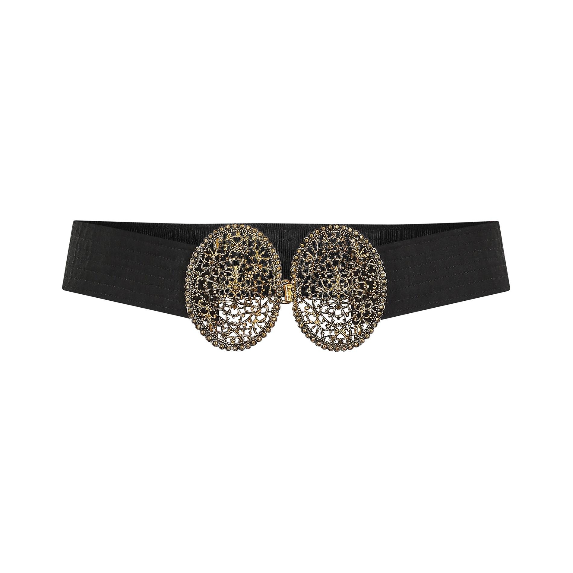 1920s - 1930s but conceivably much earlier, black fabric and gold filigree style belt.  Featuring a black crepe waistband which has been set atop a stronger woven fabric and machine stitched in close-set horizontal bands.  The brass belt buckle is