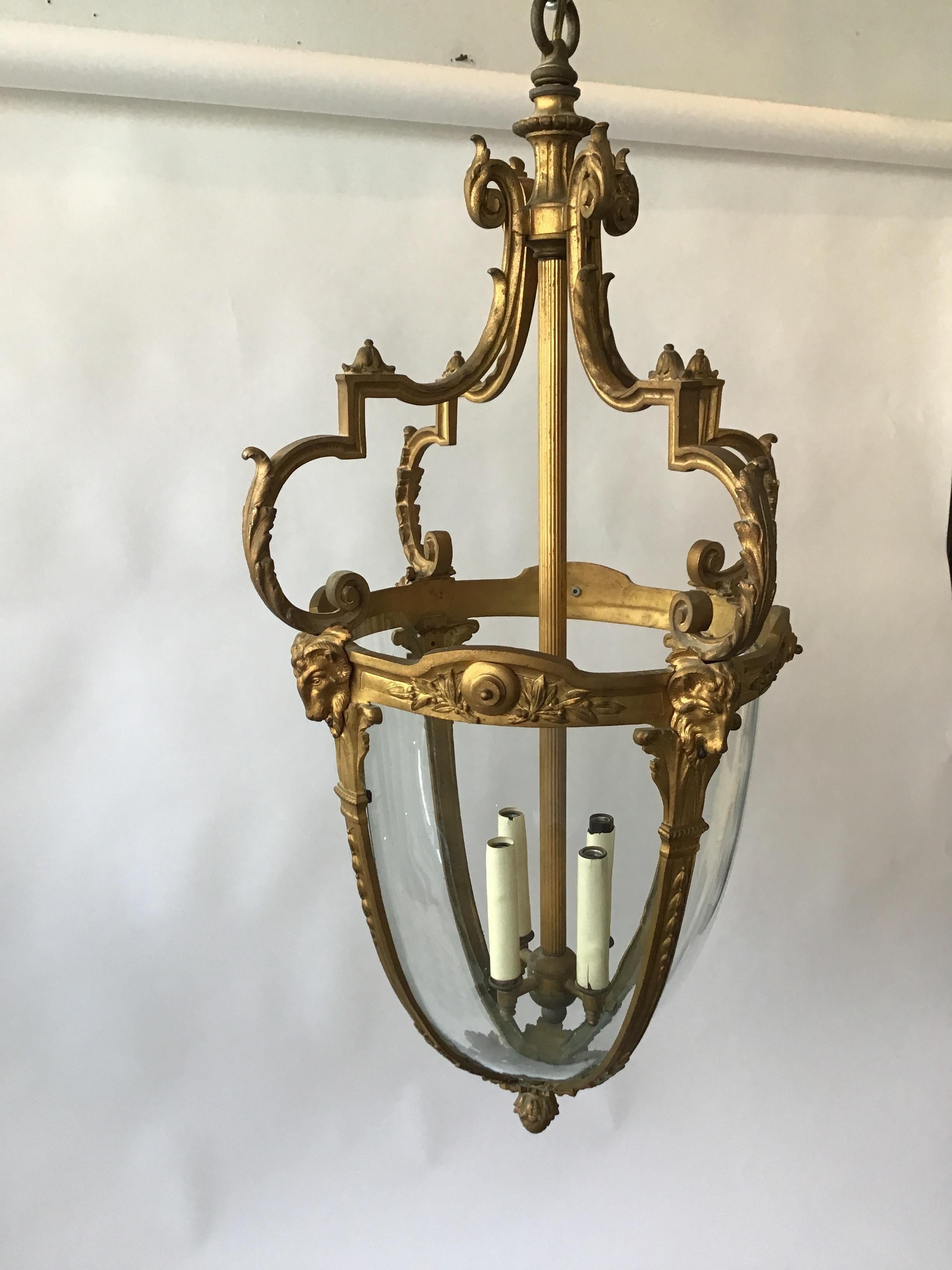 1920s French gilt bronze ram's head lantern. On the large side. One pane of glass is missing. I might have a person who can make one.