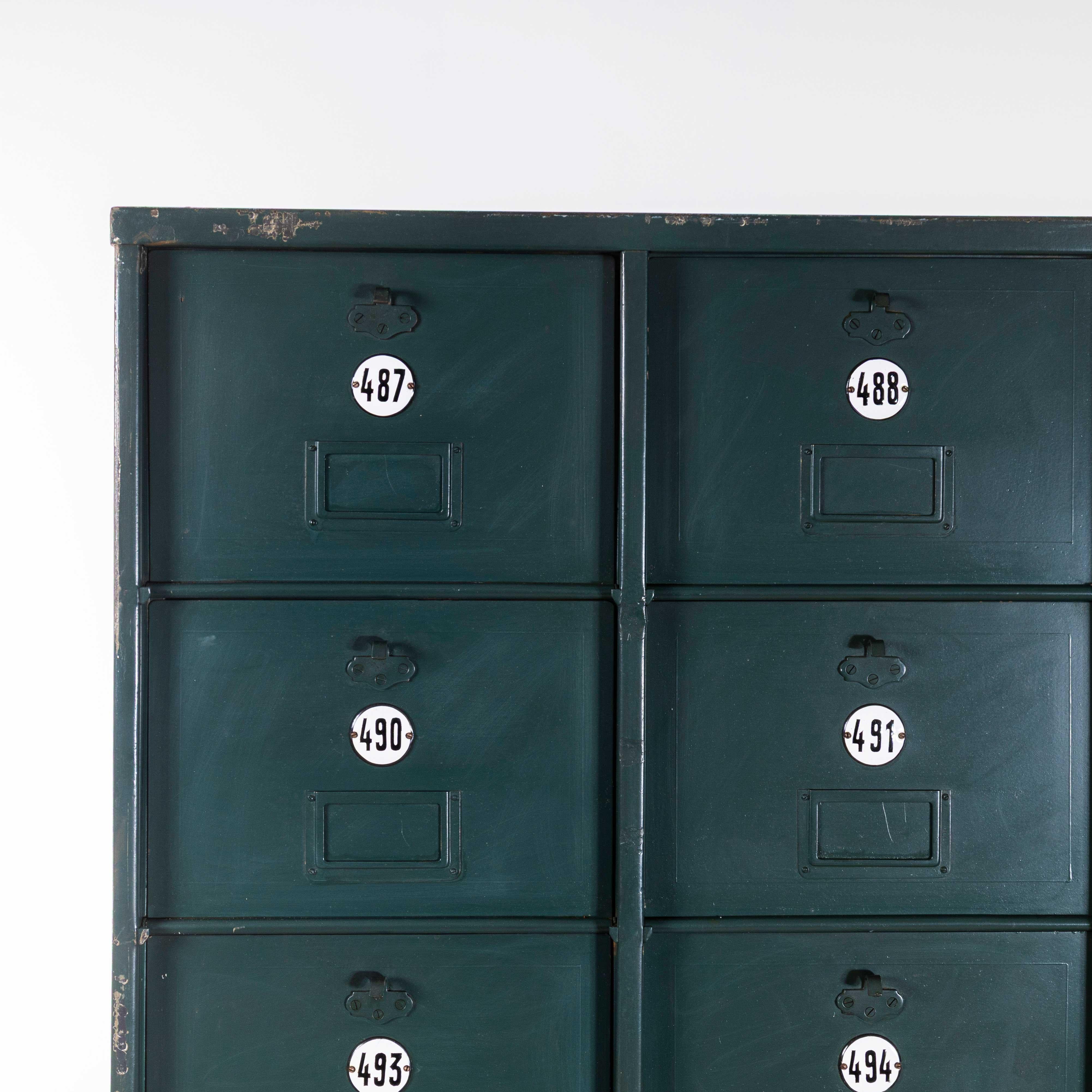 1920’s French Industrial Metal Cabinet Dark Green – Twenty Seven Klappets. 

Beautifully made very heavy weight sheet metal filing cabinet, with twenty seven hinged ‘klappet’ compartments. The compartments are the perfect size for A4 documents