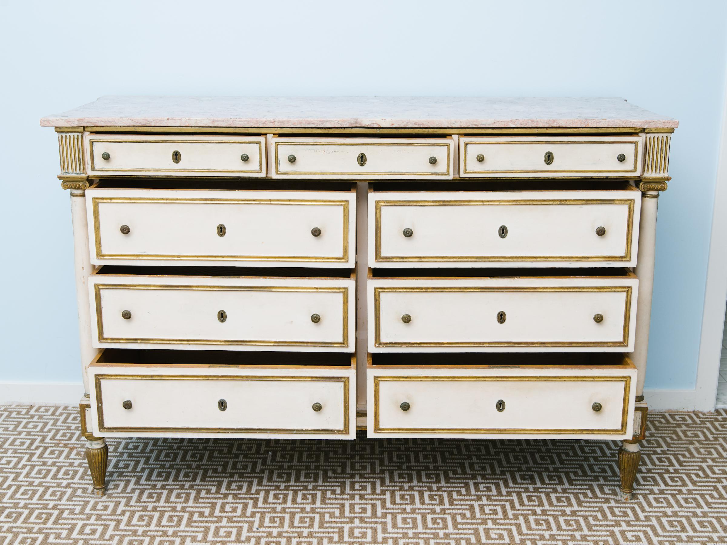 1920s French marble-top dresser with gilt accents.