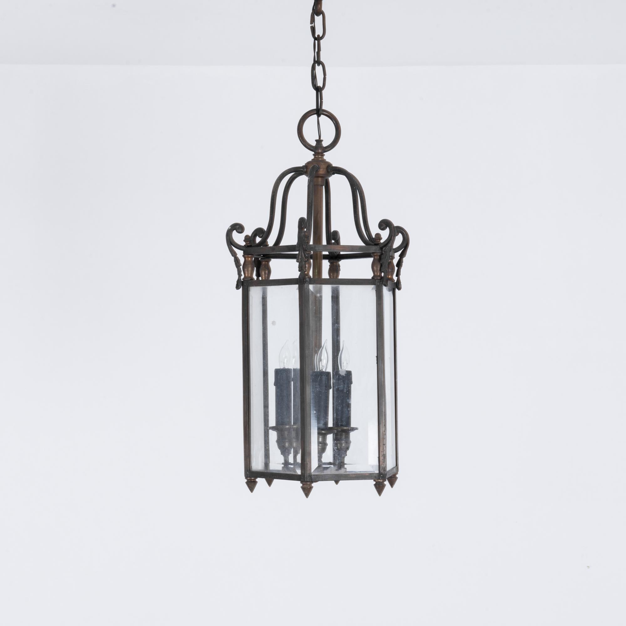 An electric lantern from France, circa 1920. Six wings rise above lights housed in a glass hexagon; the soft orange glow from the chandelier in the entryway says “You’re Home”. A stylish addition for the discerning foyer; a classic old-world style