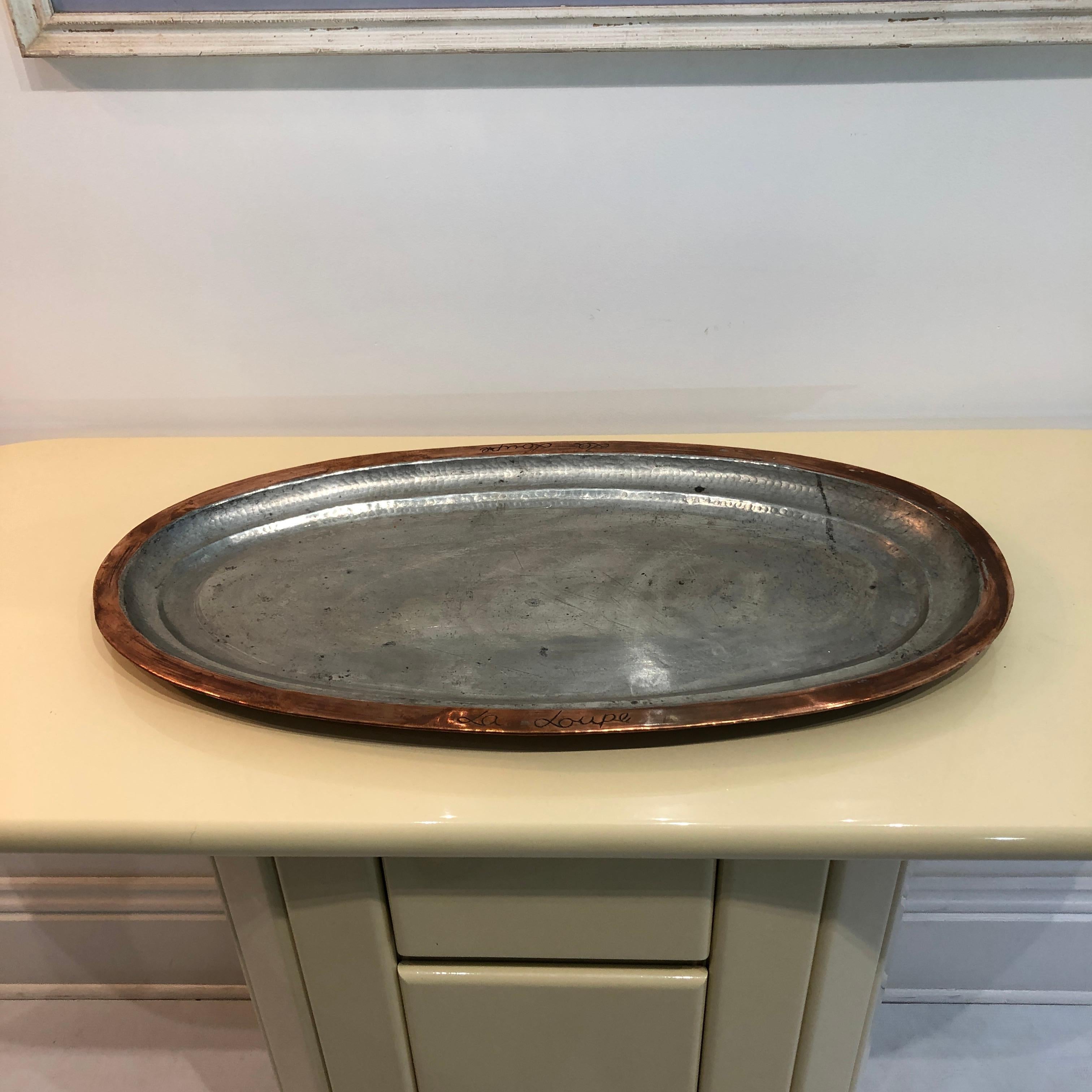 a really amazing selection of copper fish platters coming from the French Riviera and an old restaurant called La Loupe(wolf fish).
copper body with silver chrome plate on the serving area.
beautifully made with hand signed the La Loupe name of the