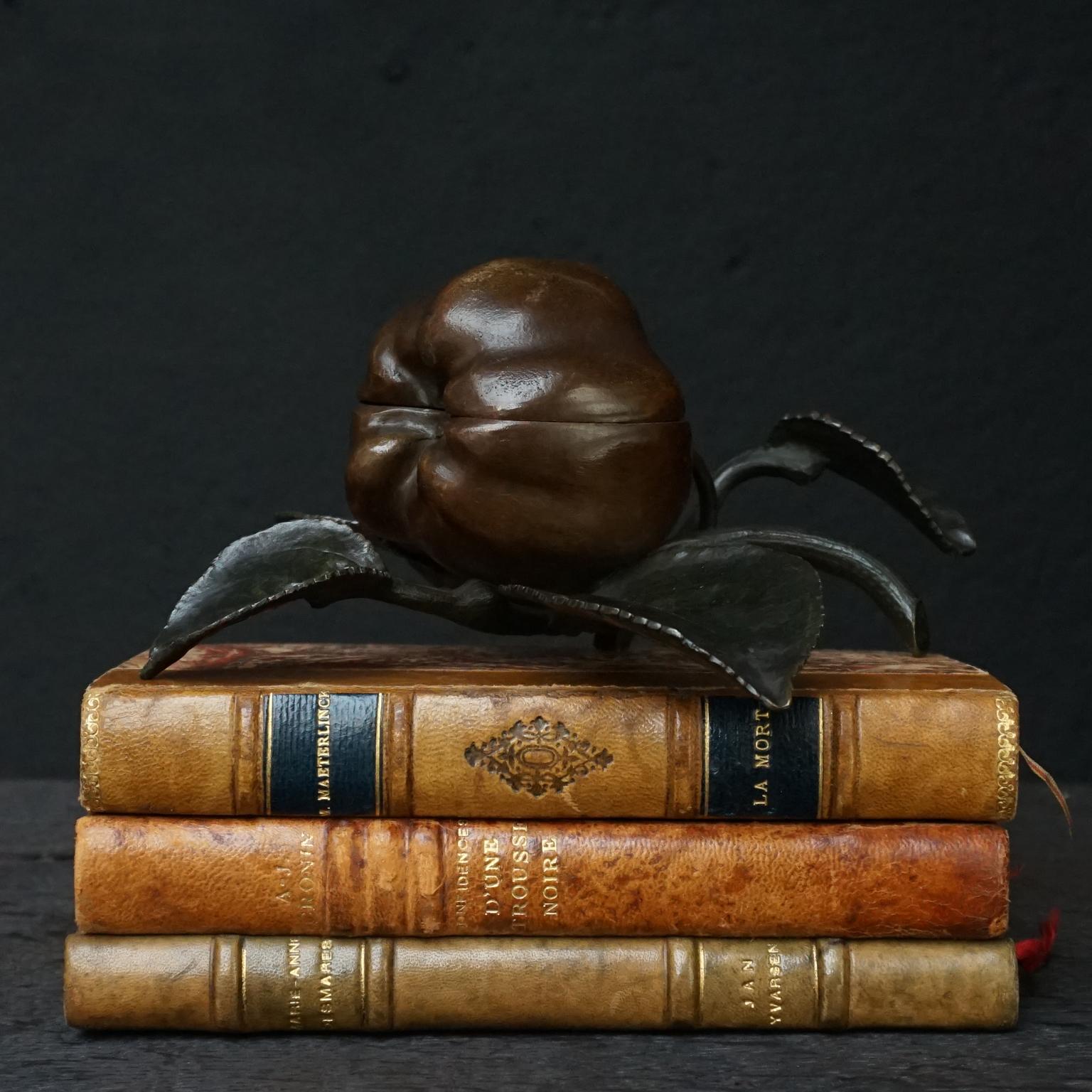 Antique hinged bronze two toned paint patinated apple on a twig with leaves, to keep or collect your little trinkets in.
The paint patina creates a deep golden apple colour on the shiny apple cheeks and the elegant thin detailed leaves have a