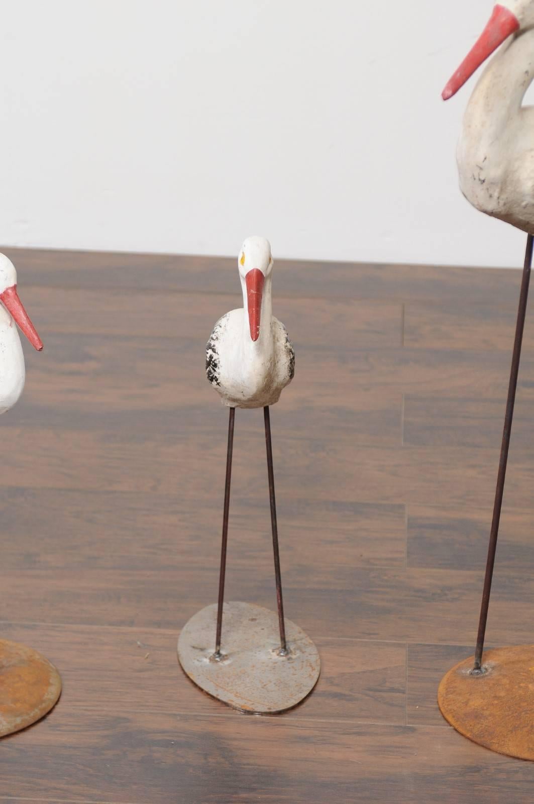 1920s French Painted Stone Storks from a Zoo in Alsace, Mounted on Iron Bases In Good Condition For Sale In Atlanta, GA