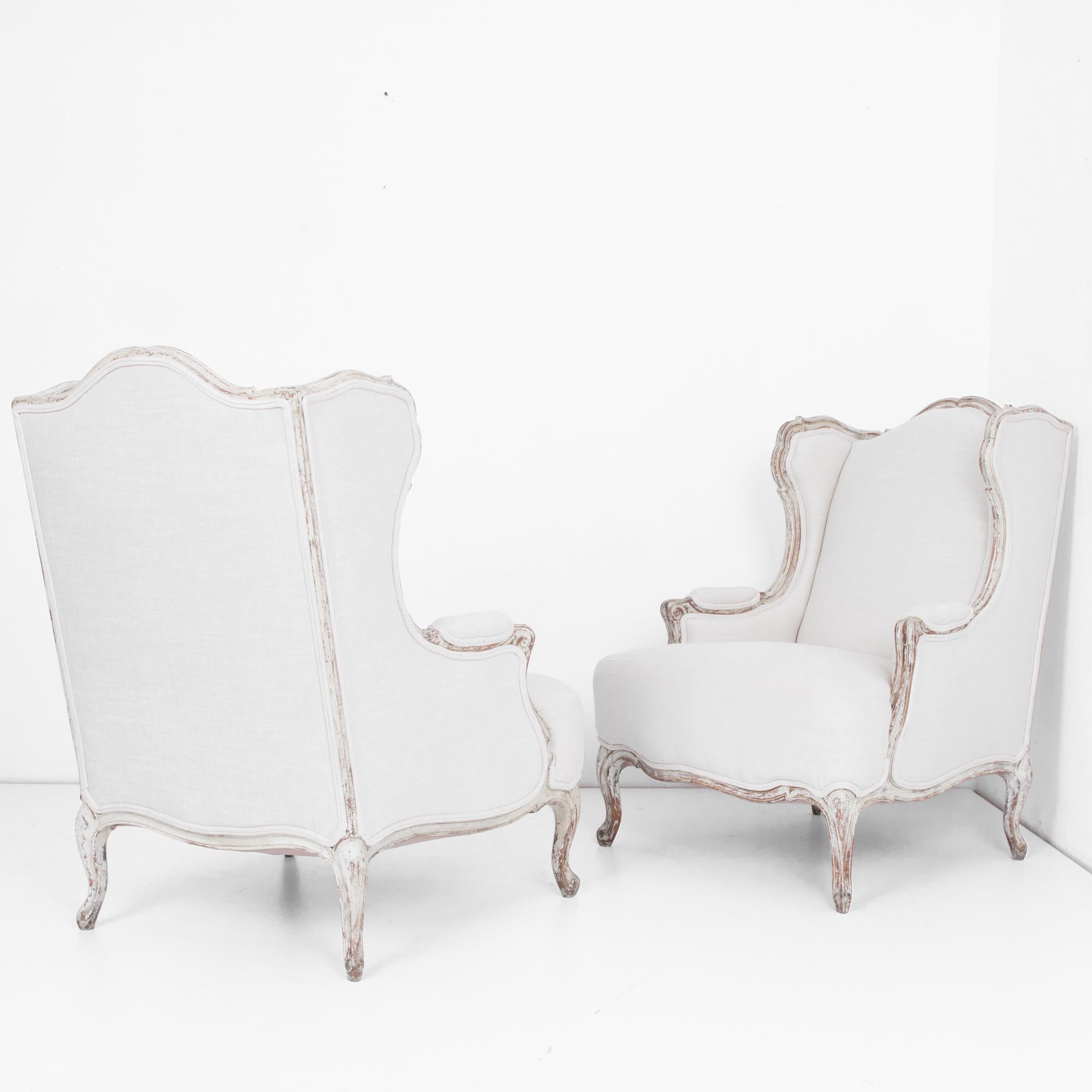 Early 20th Century 1920s French Provincial Upholstered Bergère Chairs, a Pair