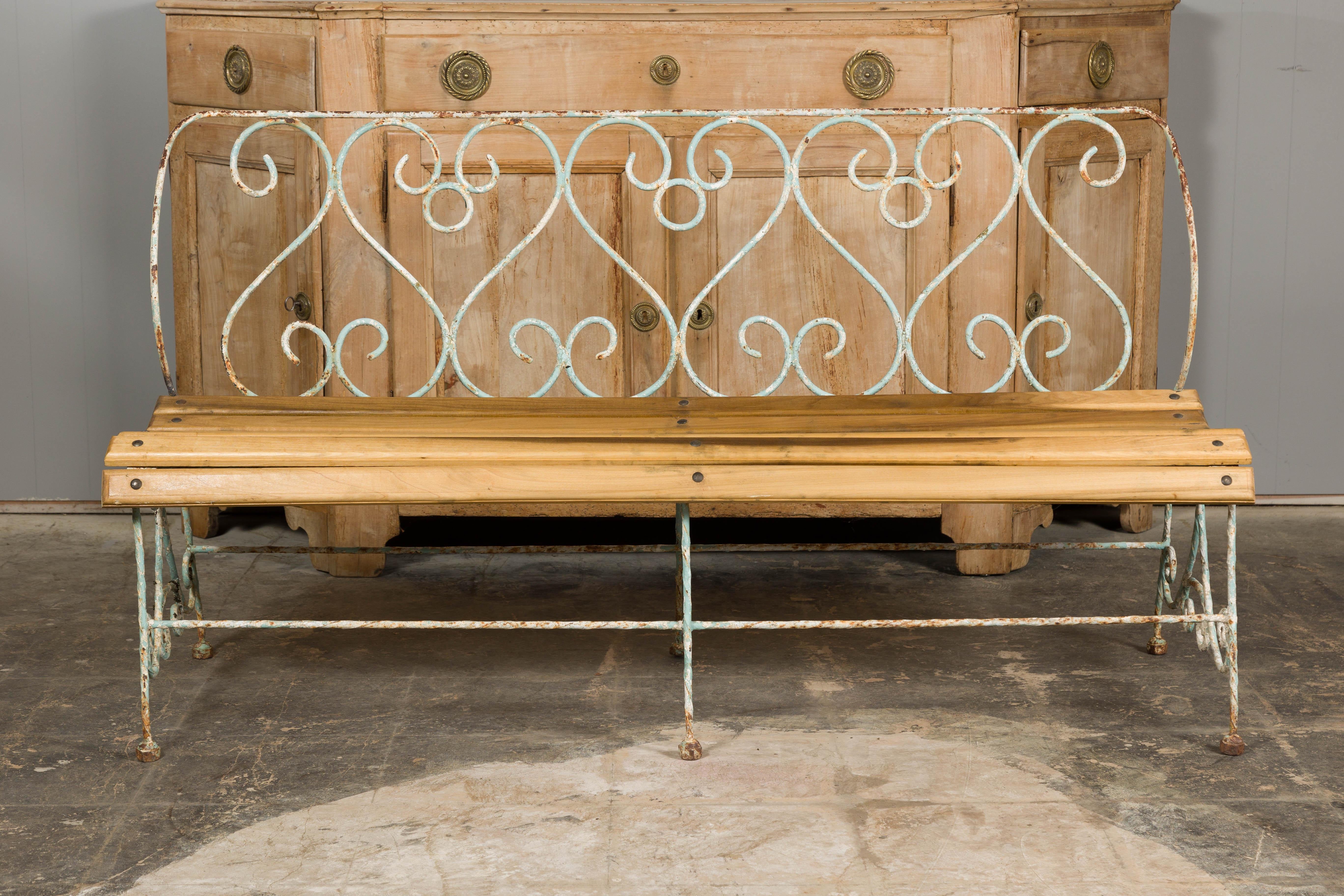 Painted 1920s French Rustic Iron Garden Bench with Scrolling Motifs and Slatted Seat For Sale