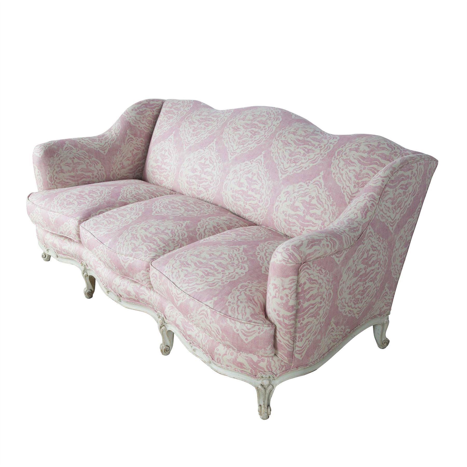 A wonderful and shapely 1920s French painted sofa in Louis XV style, the frame in original white paint, recovered in a Penny Morrison printed linen.