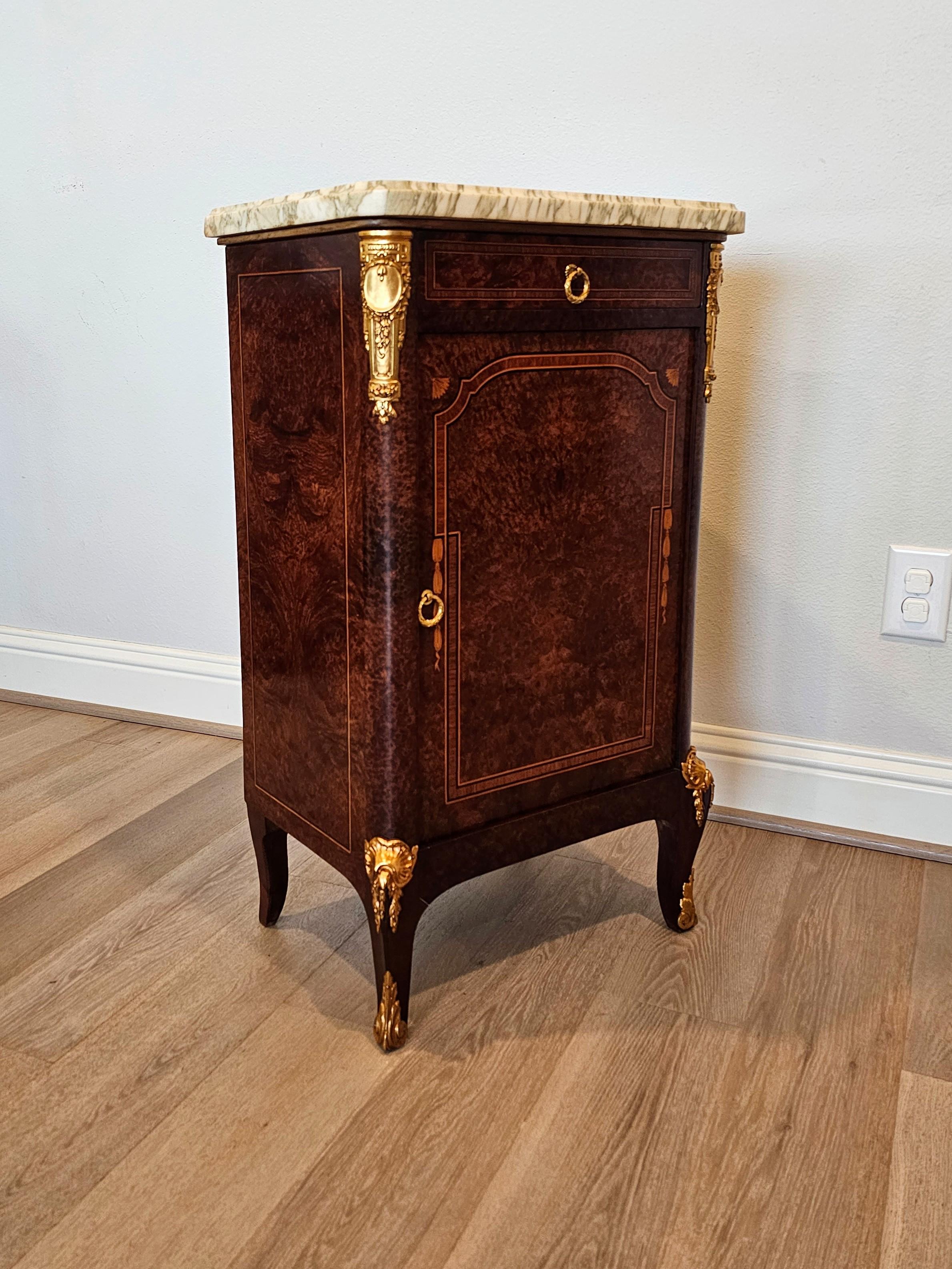 A stunning fine quality antique French Transitional Louis XV - XVI style exotic Amboyna burlwood marble-top bedside cabinet. circa 1920

Born in France in the early 20th century, fine quality Parisian craftsmanship, exceptionally executed in