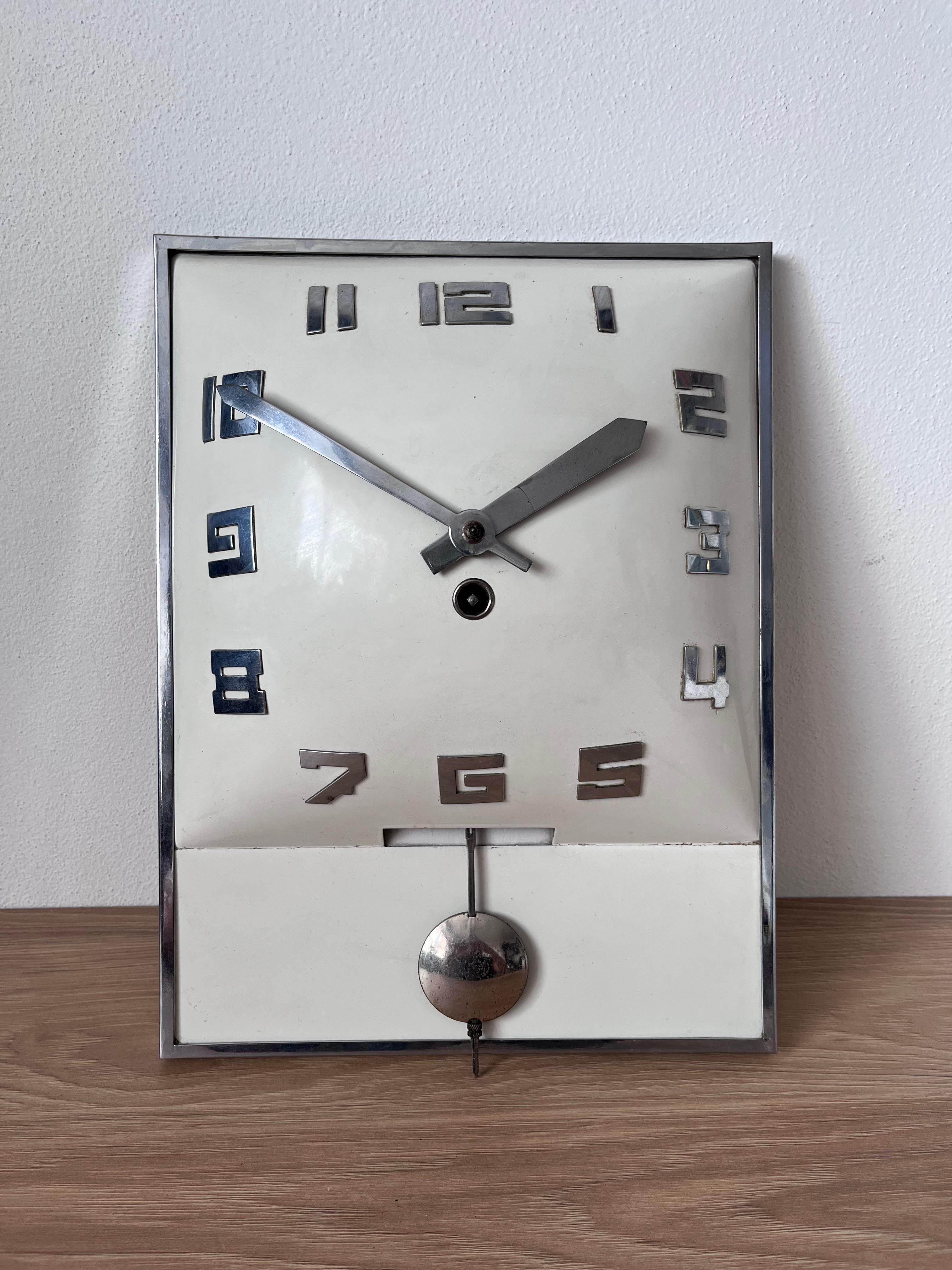 - Very unusual Functionalist wall clock from Czechoslovakia
- The clock running very good
-  the chimes was professional cleaned and oiling.
- They are in very good original condition.
- The key and pendulum is including
- Dimensions: Heights-31cm,