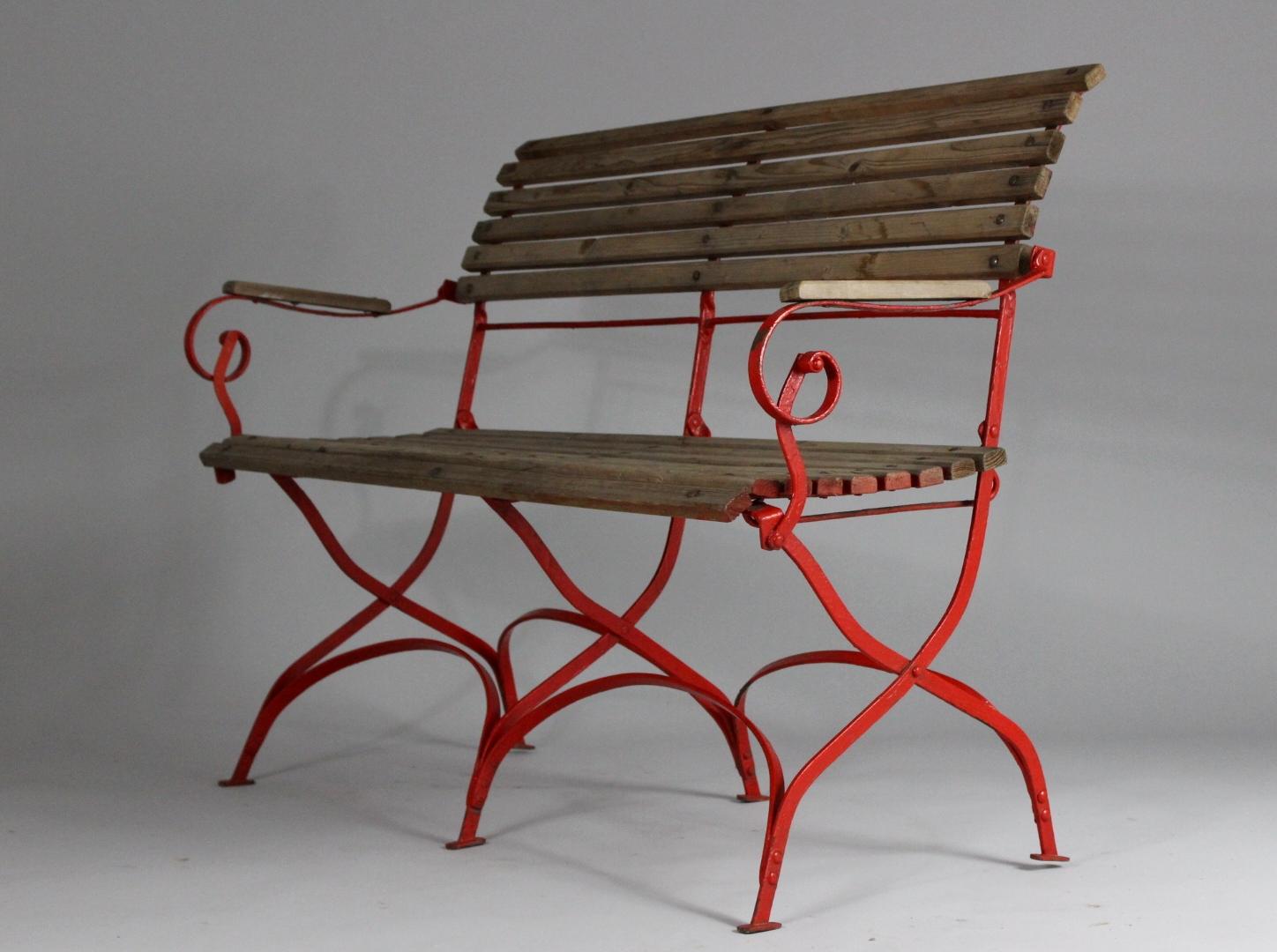 Garden bench from the 1920s. It is made from steel and wood, good condition with patina.