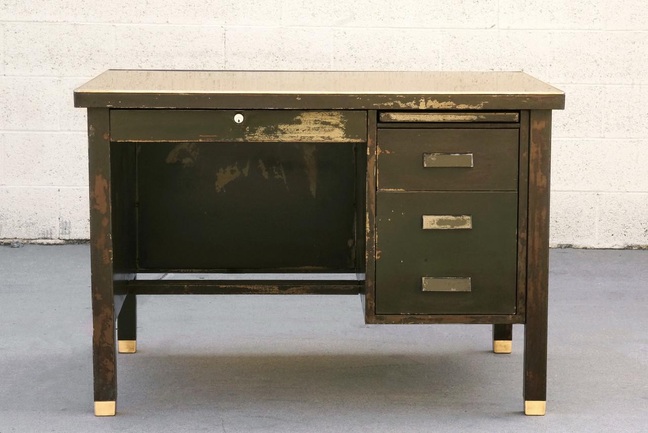 Very early model single pedestal tanker desk by General Fireproofing, c. 1920s. Its incredible patina is a combination of several layers of paint distressed over decades. Features refinished desktop with 1/8