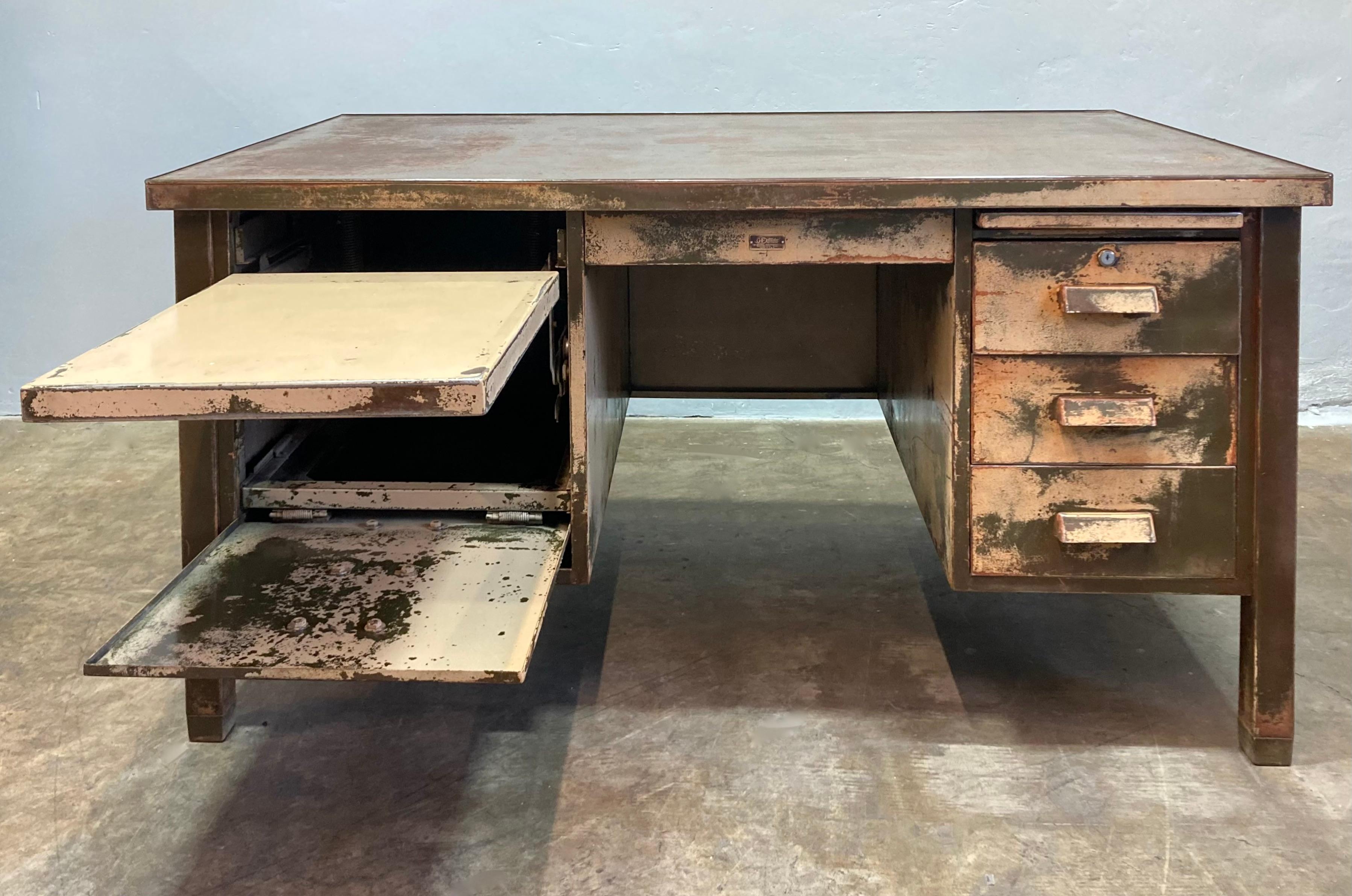 1920s Double Pedestal tanker desk with a built-in typewriter tray.  Original paint distressed to a fabulous patina.  Clear lacquer finish.

60