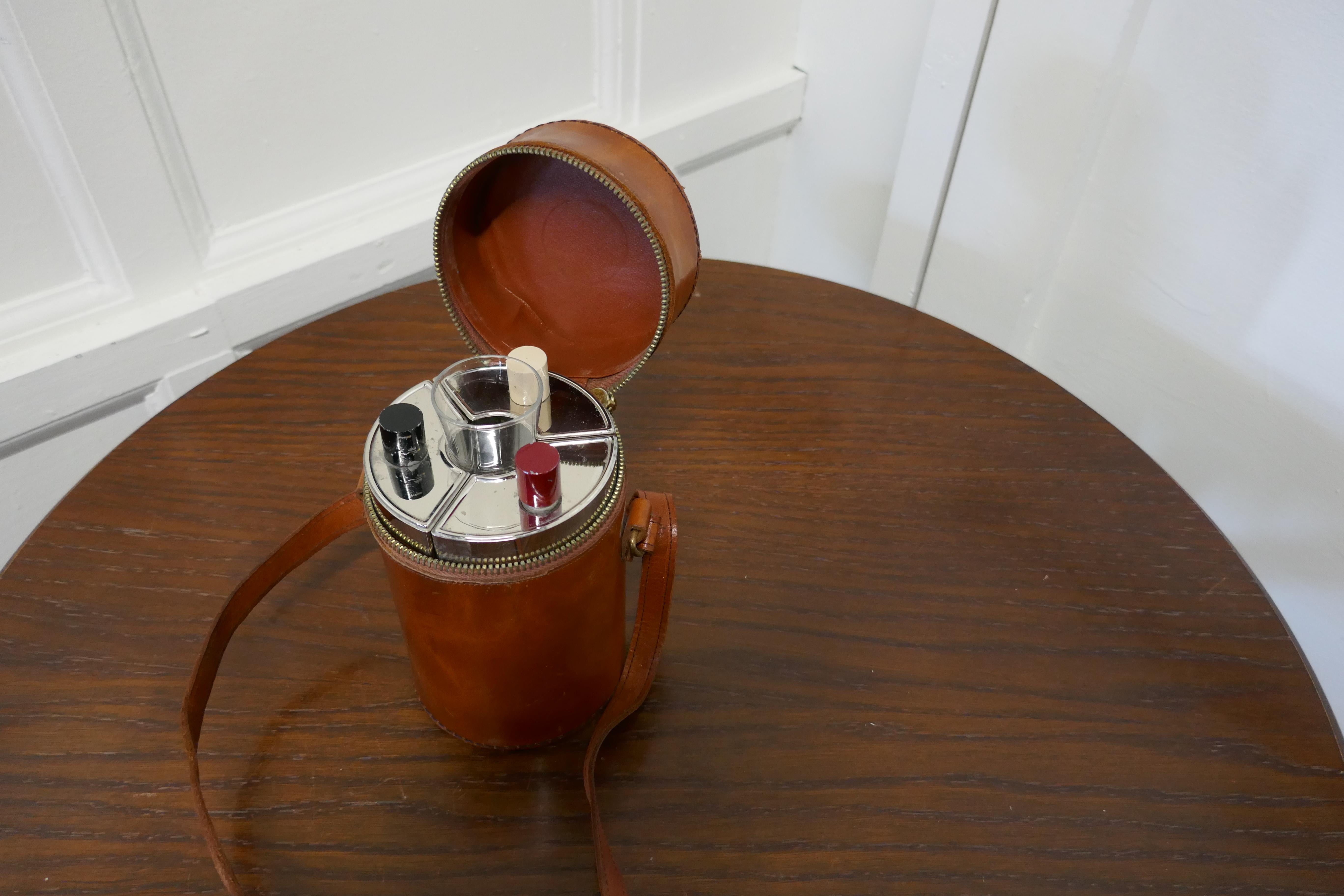 1920s German huntsman’s drinking flask set

A very unusual piece, the set of 3 shaped chrome flasks sit in a circle in their leather hide zip up box with the shot glass which sits in the centre
The flasks have 3 different colored lids no doubt to