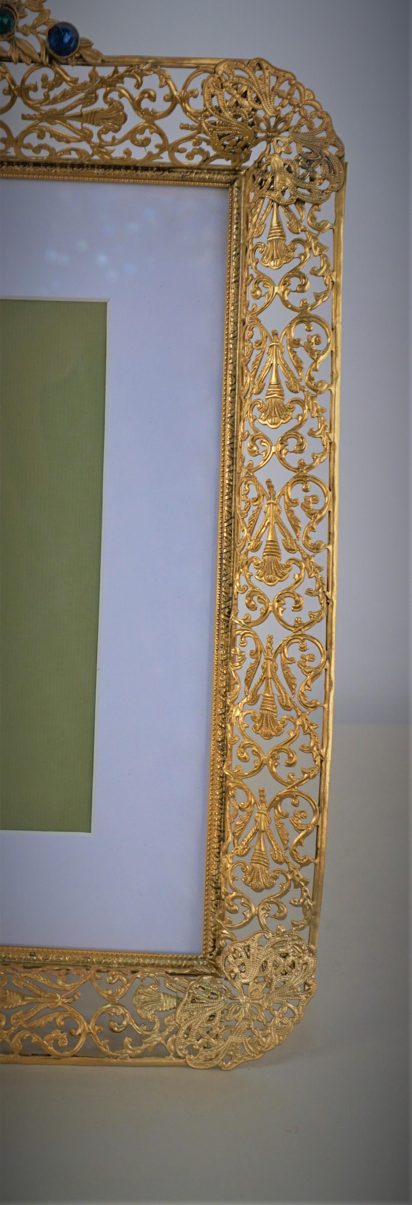 Gilt bronze/brass picture frame with glass jewels
Replacement backing and inside. 
Measurement: 13.25