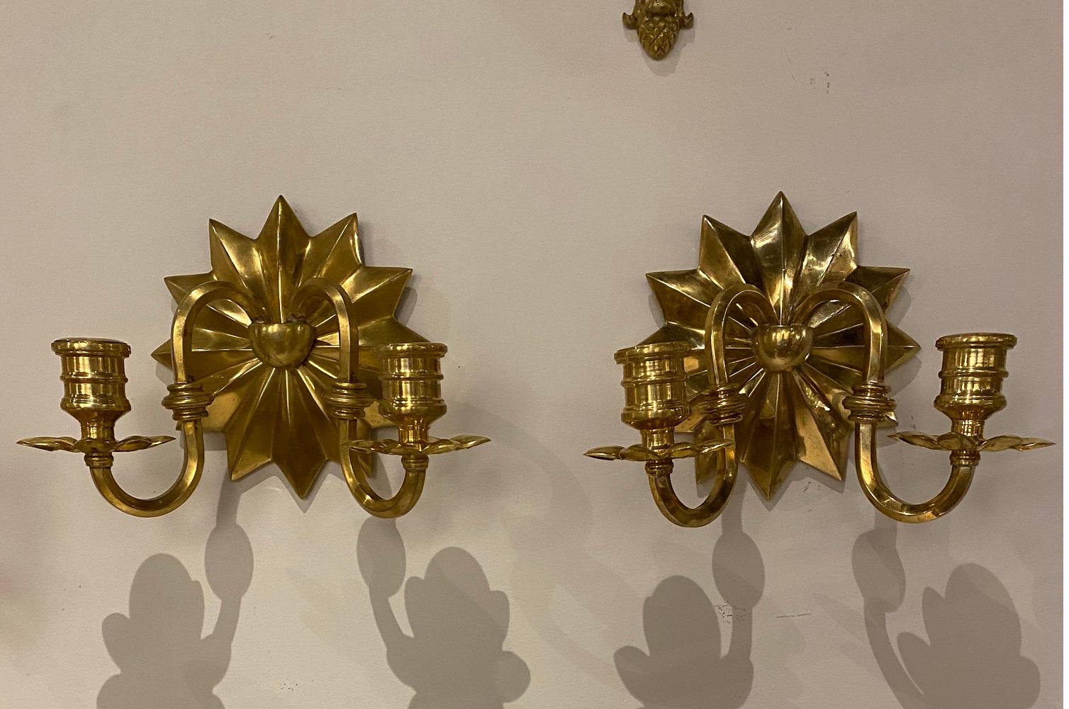 Pair of circa 1920’ gilt bronze sconces sunburst backplate  with two lights