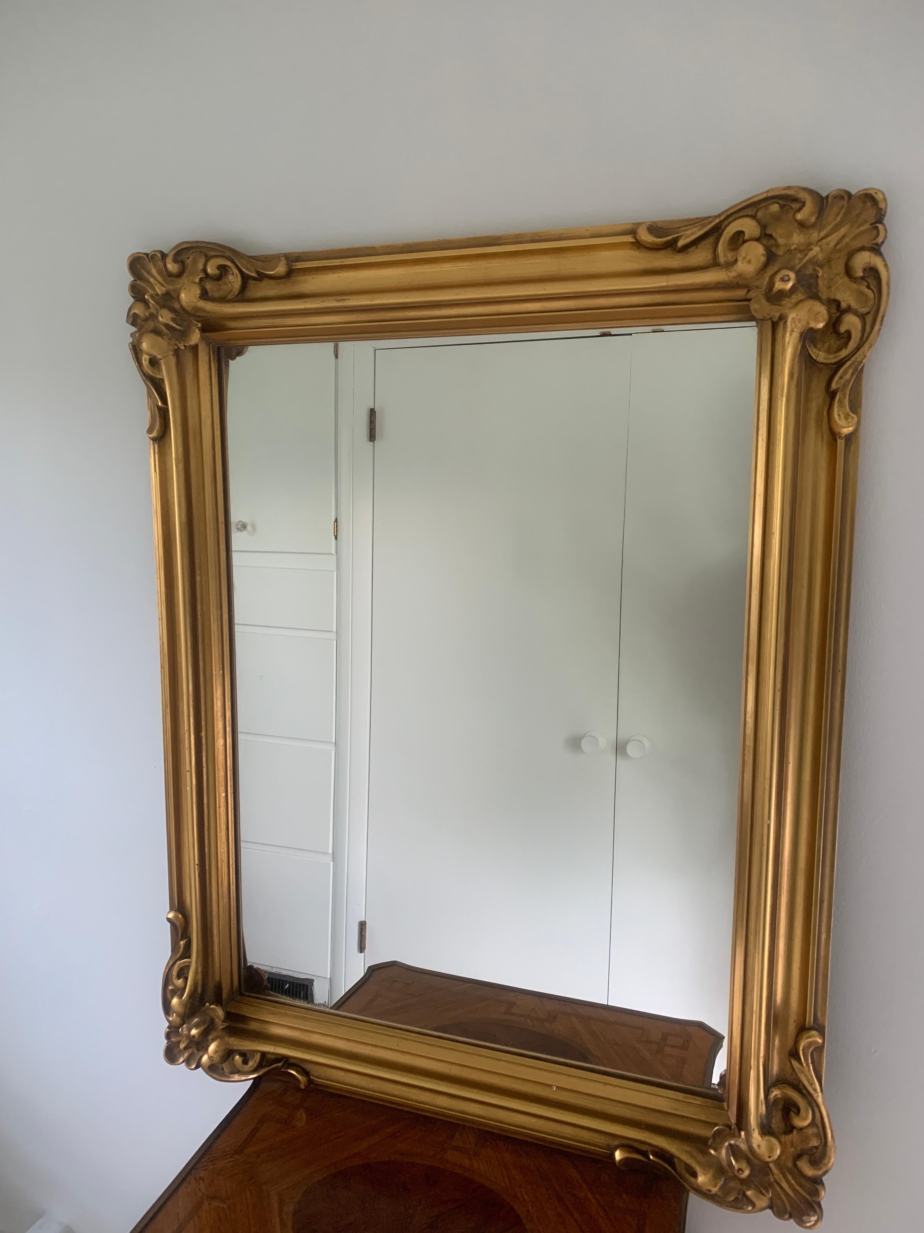 A beautiful 1920's gilt framed mirror made by H. Lieber Company of Indianapolis, Indiana. The frame is beautifully made and the glass has been replaced.
