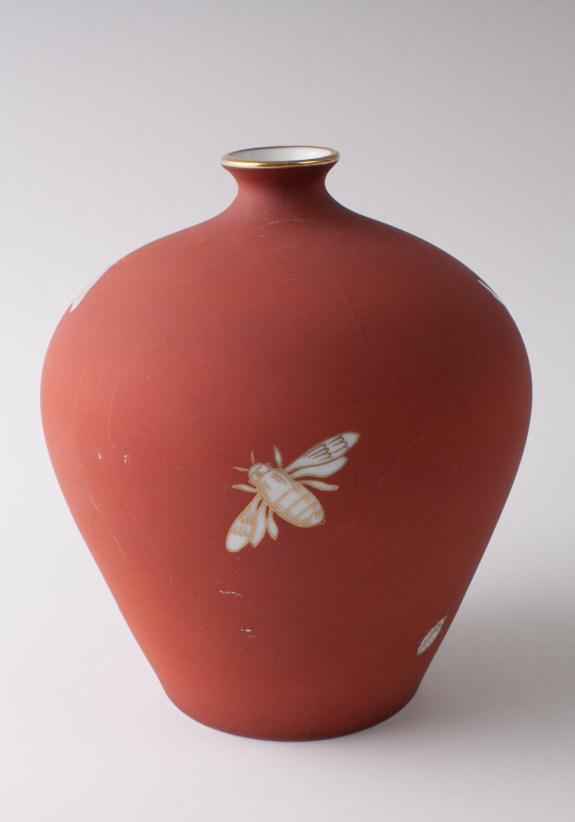 Exceptional and early 1920s-1930s Richard Ginori Vase Designed by Giovanni Garibold. This beautiful example is constructed of a glazed porcelain with smooth rust backround and features an insects theme each of which are hand-painted and outlined in