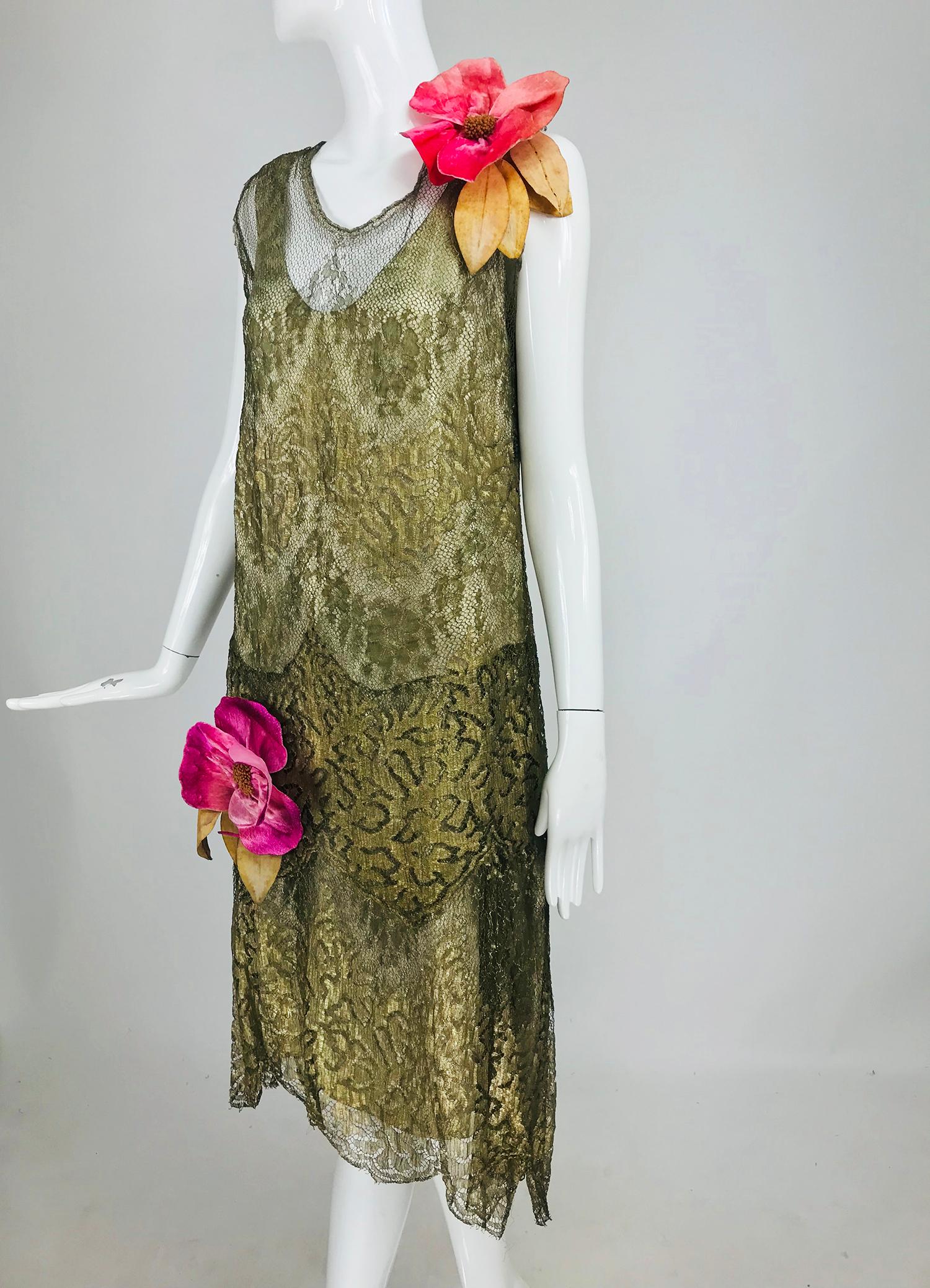 1920s gold metallic lace flapper dress vintage. This fabulous dress is such a wonderful example of the extravagance that was the the 20s. The gold of this lace is weighty and glitters in the light. The bodice has a round neckline that is edged in