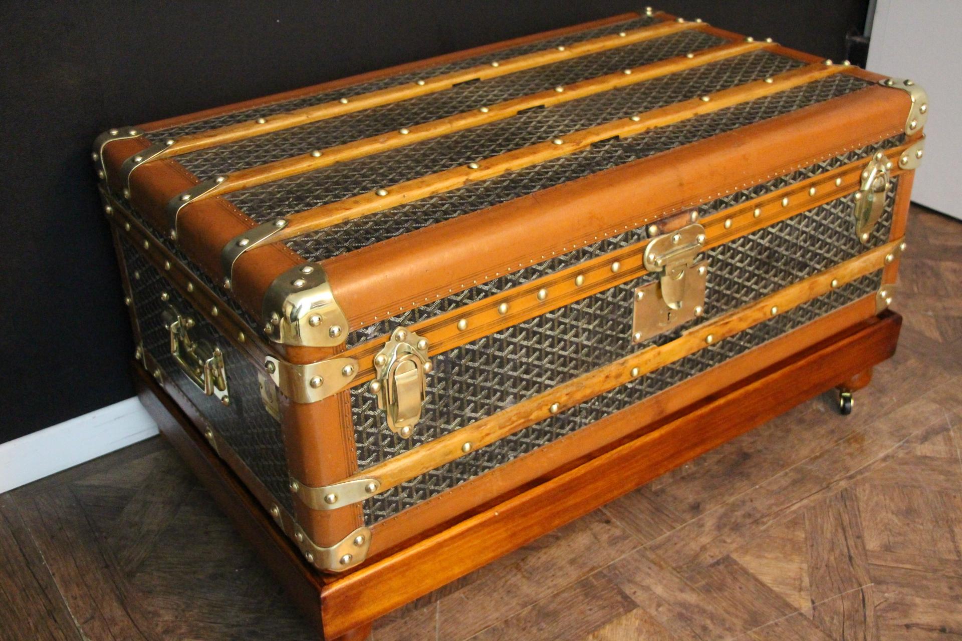 This superb Goyard steamer trunk features the very sought after chevrons canvas as well as all solid brass fittings: Goyard marked side handles and locks. Brass studs. It also has its brass Goyard plaques on each side. This trunk has many wood slats