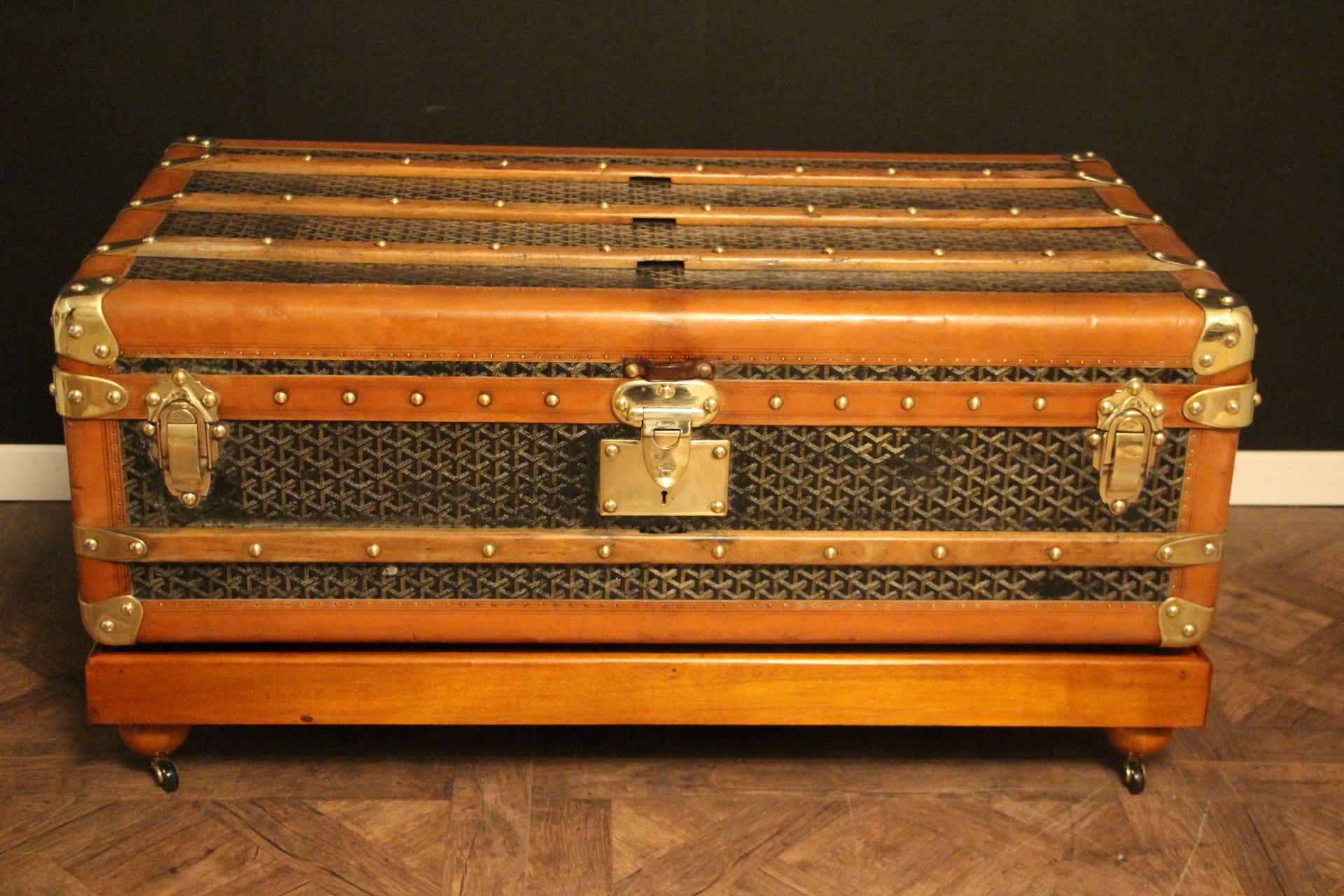 This Goyard steamer trunk features the very sought after chevrons canvas as well as all solid brass fittings: Goyard marked side handles and locks. Goyard plaques on each side. Brass studs. This trunk has many wood slats as well as all large honey