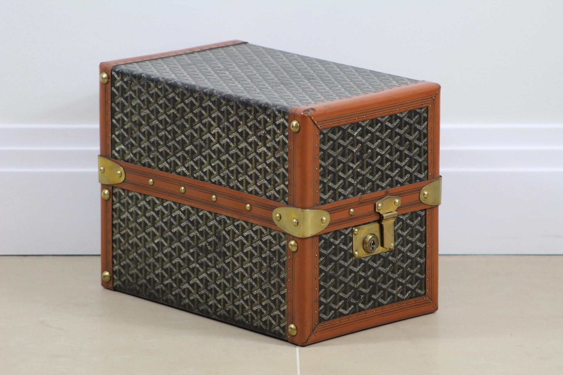 

The 1920s Goyard Library Trunk is a sublime piece of artistry, steeped in history and resonating with the aura of a bygone era. Dressed in Goyard's iconic Chevron canvas, the trunk immediately commands attention with its unmistakable pattern – a