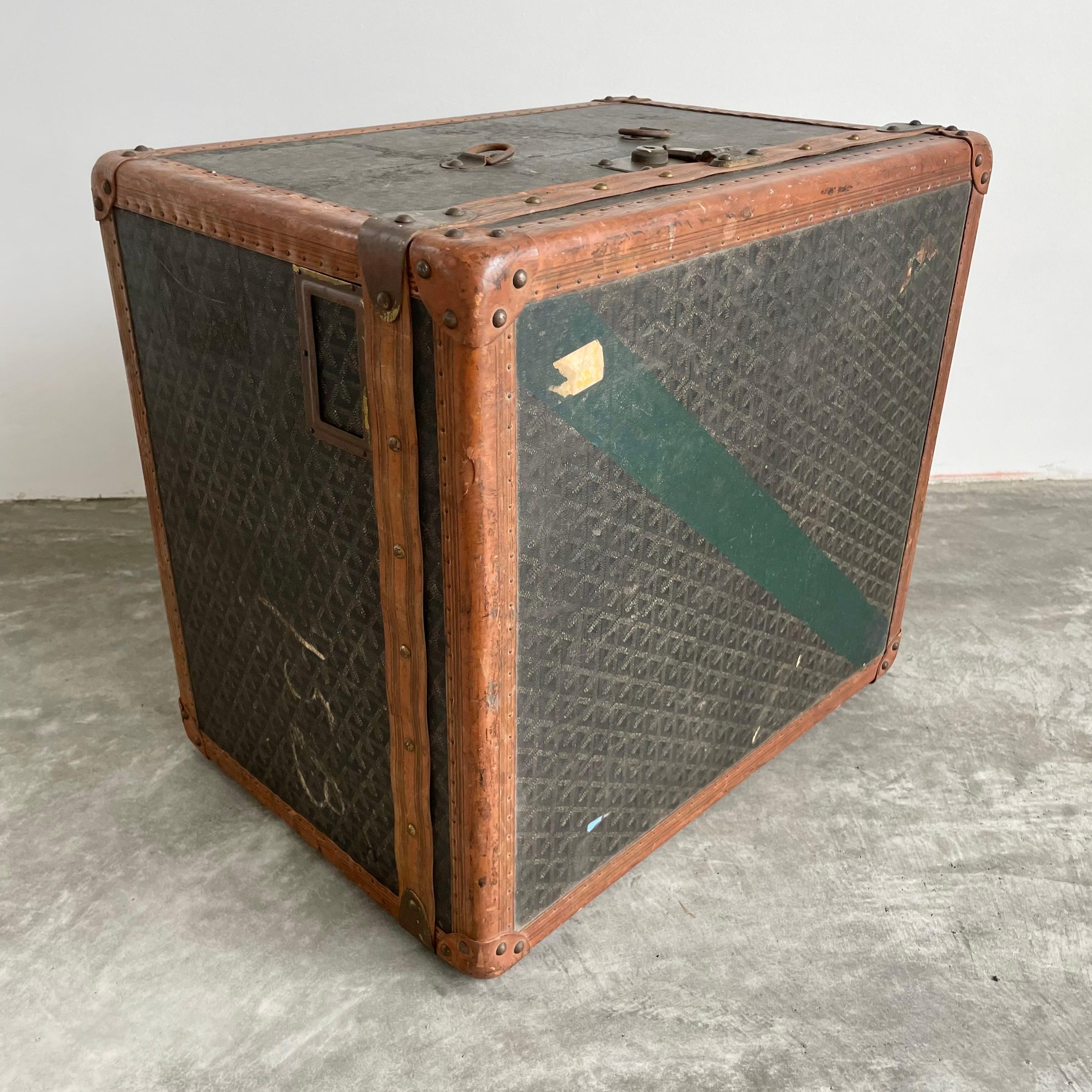 Classic vintage Goyard trunk. Iconic Goyard print with saddle leather and brass hardware. Timeless simplicity in design and iconic badging have made this brand a staple of elegance since 1853. Initially started as a malletier for the aristocrats of