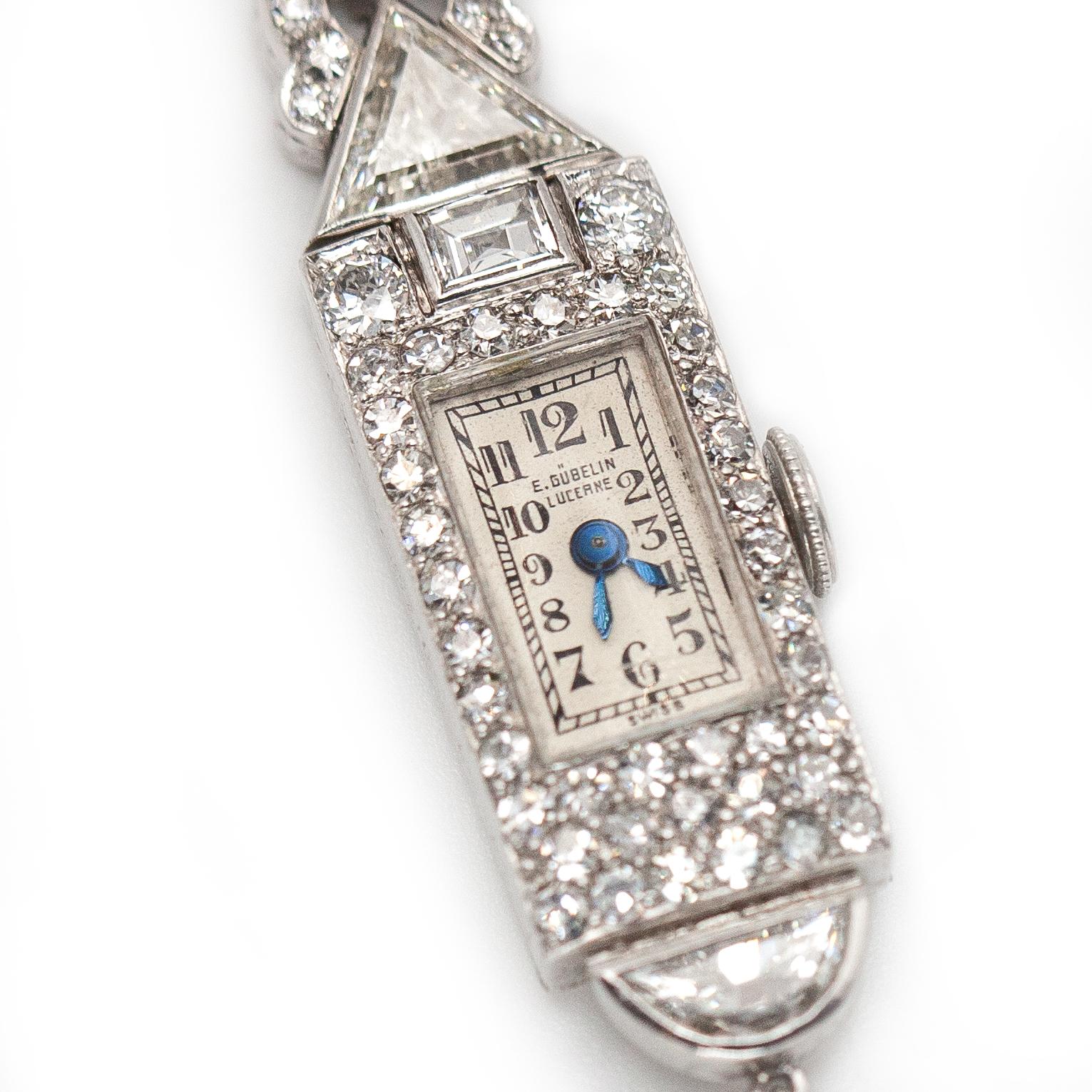 Stunning Art Deco E. Gubelin Lucerne Platinum Diamond Lapel Watch set with 71 old European and single cut diamonds, 5 baguette diamonds, 4 trillion cut diamonds, 1 half moon diamond and 1 pear cut diamond approximate total 4.11 carats in G-H color