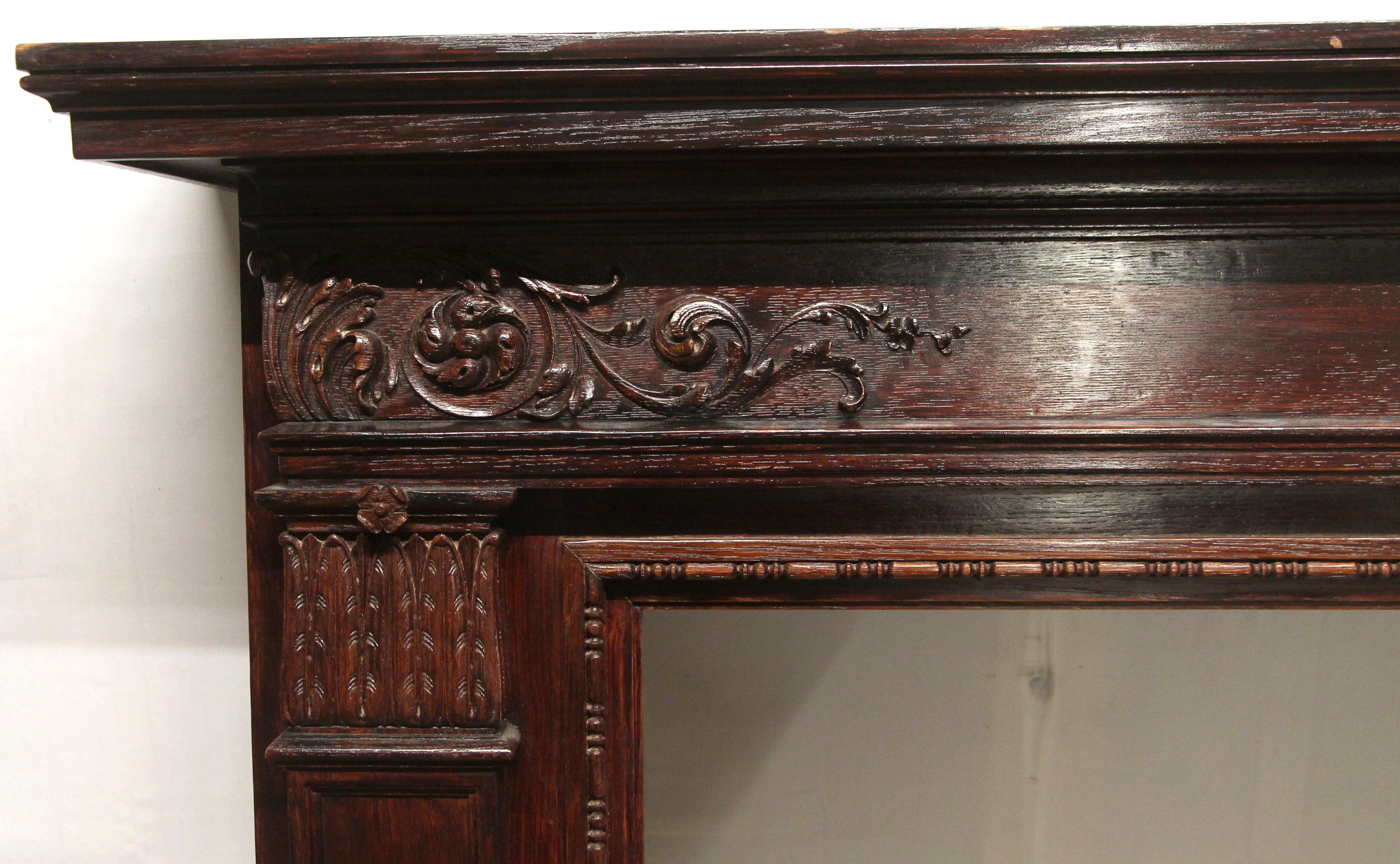 American 1920s Hand Carved Wood Federal Style Mantel with a Dark Mahogany Finish
