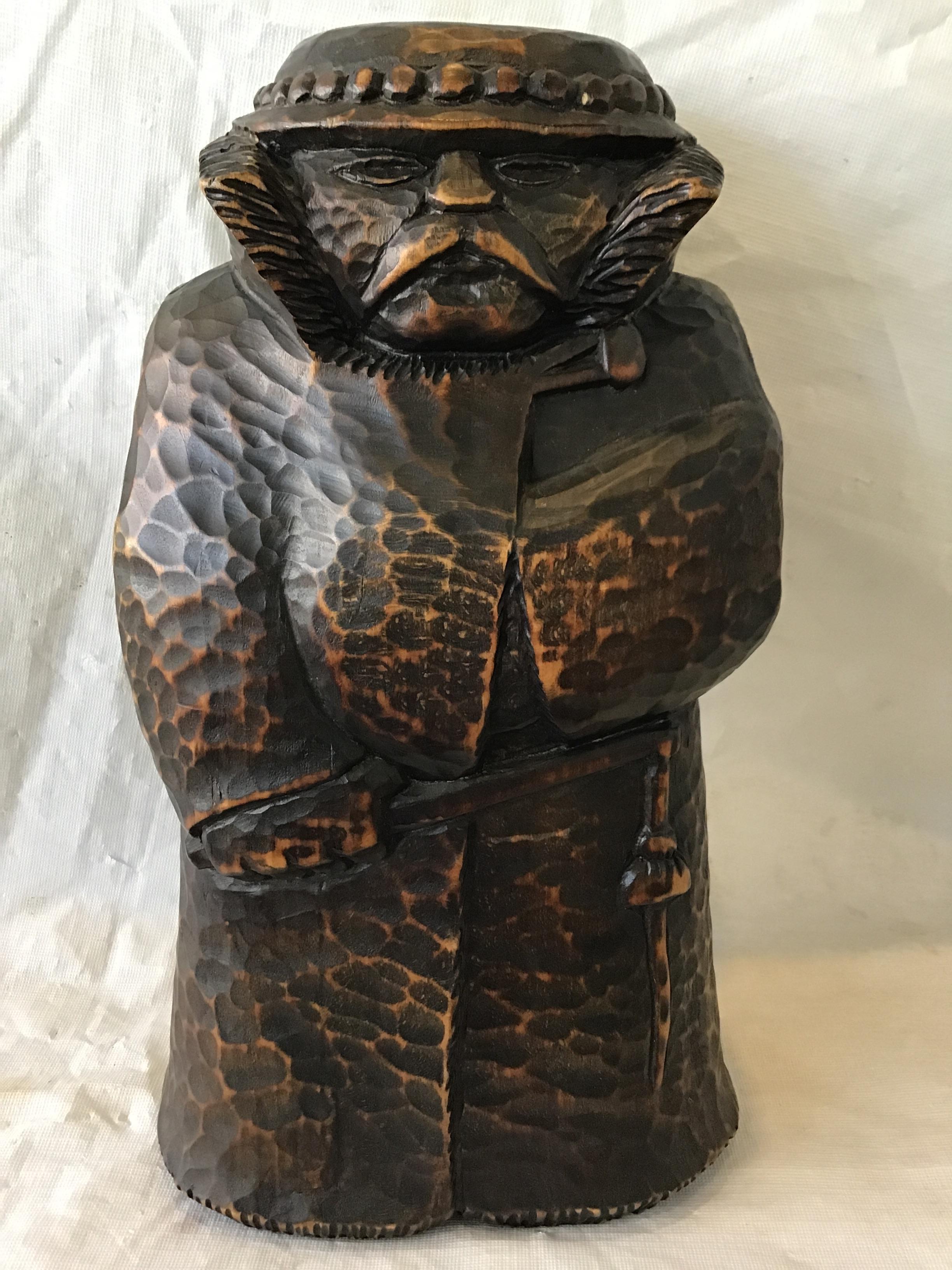 1920s hand carved wood figure, which has an insert to hide a bottle of alcohol. Great piece of Folk Art.