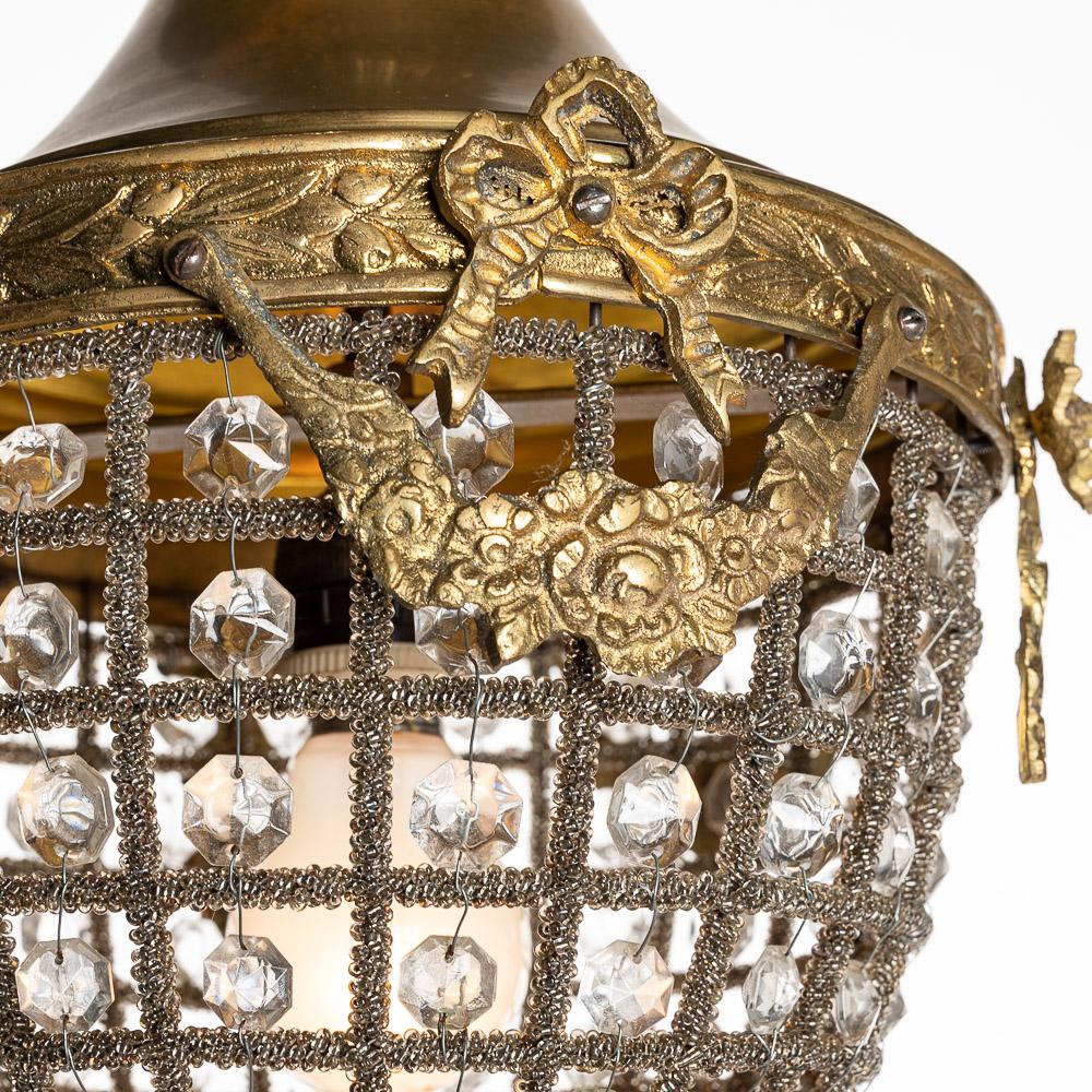 A beautiful handmade French lantern. The bronze and brass frame, crystal beads, twisted beaded wirework and it is decorated with Ormolu swags around the top make this light wonderful to look at. The twisted beaded wirework get me the most, what a