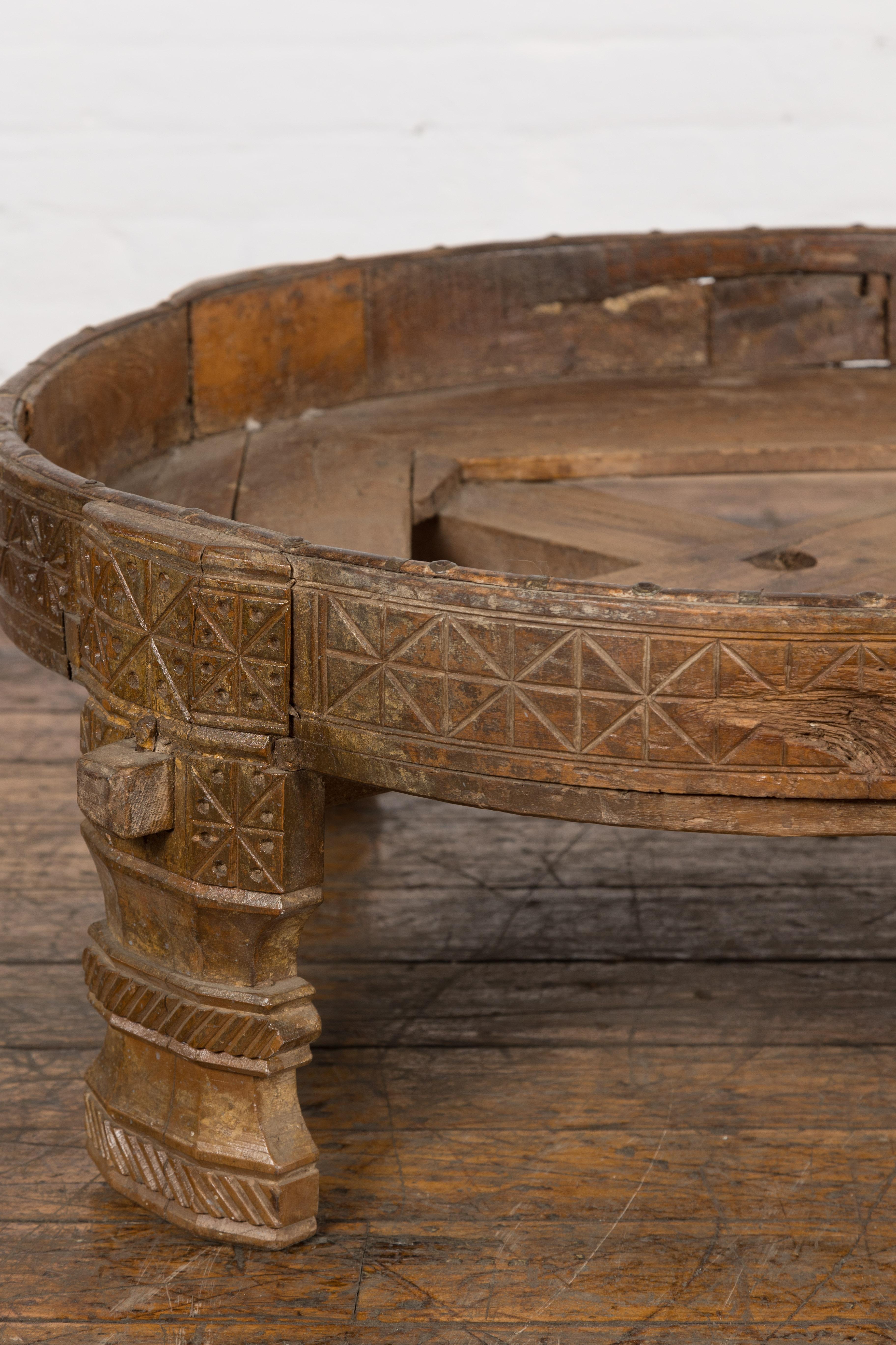 1920s Indian Antique Chakki Grinding Table with Hand-Carved Geometric Décor In Good Condition For Sale In Yonkers, NY