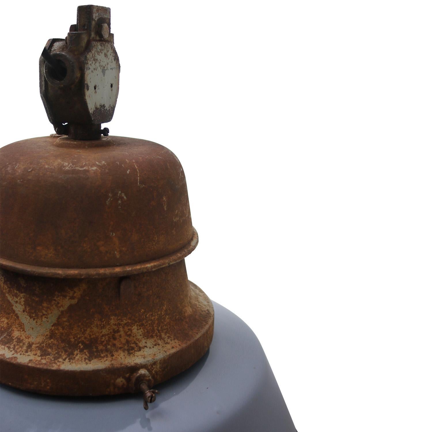 1920s old train station light by Pötter & Schütze, Germany
Gray blue enamel with big cast iron top
white interior

Weight: 12.3 kg / 27.1 lb

Priced per individual item. All lamps have been made suitable by international standards for incandescent