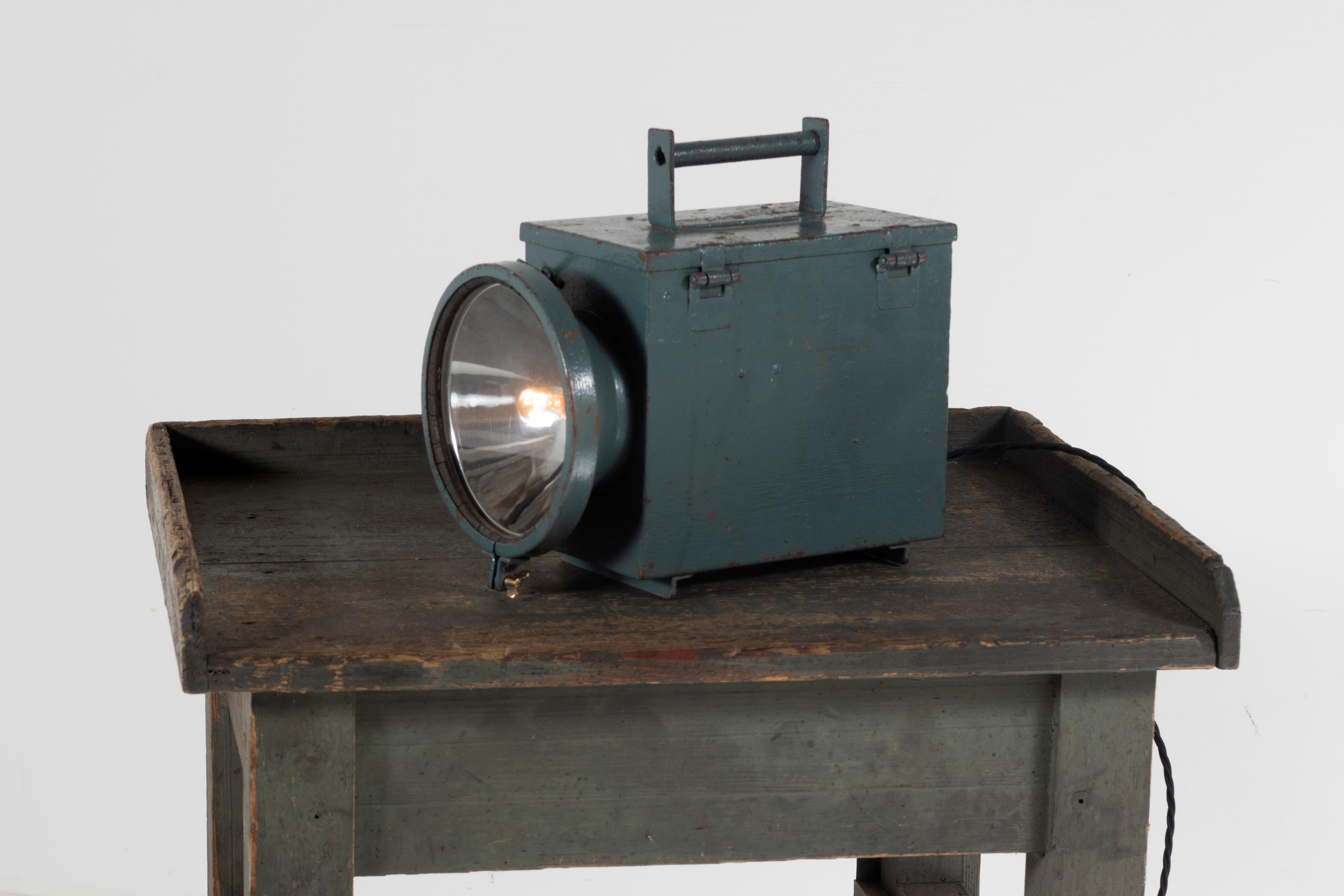 An old industrial battery torch light, probably a military lamp. In a great colour and now fully re-wired. The original battery lamp retains its original makers mark G.E.C. General Electric Company and from the label, this can be dated to circa