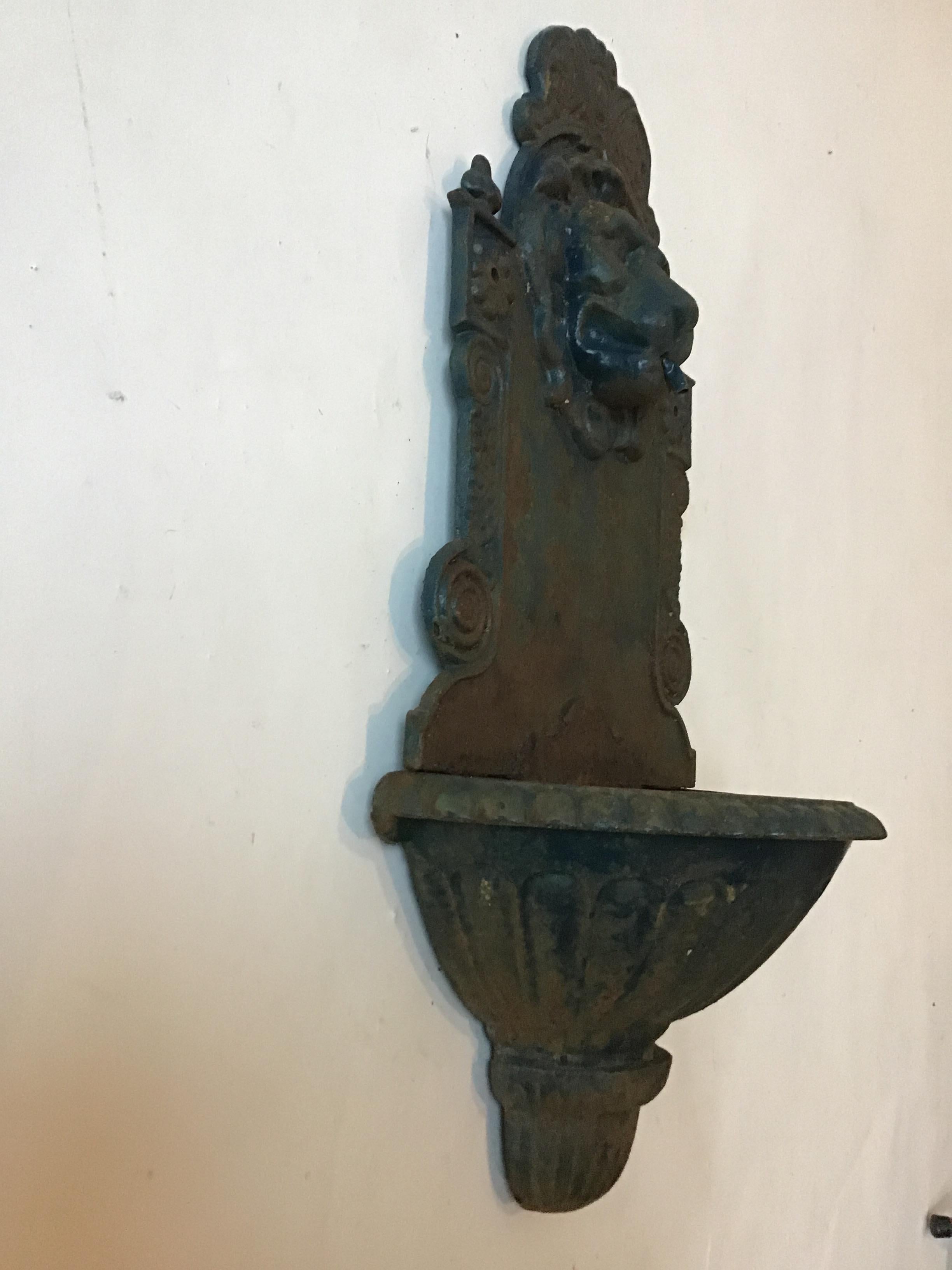 1920s iron lion head wall fountain.