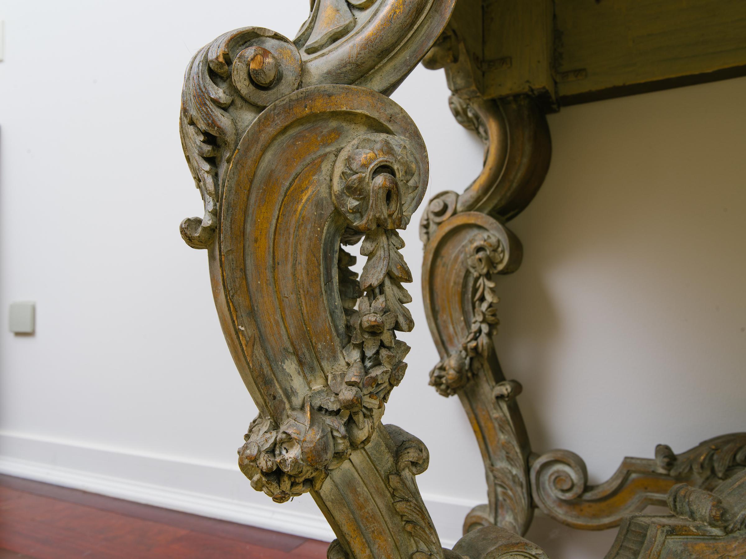 1920s Italian Rococo highly carved wood, gilt, white washed console. This piece has a marble-top. This was originally in a Connecticut convent for 90 years, then sat in the dining room of a Greenwhich mansion.