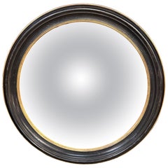 Grand miroir rond convexe italien des années 1920, laqué noir et orné de dorures à la feuille